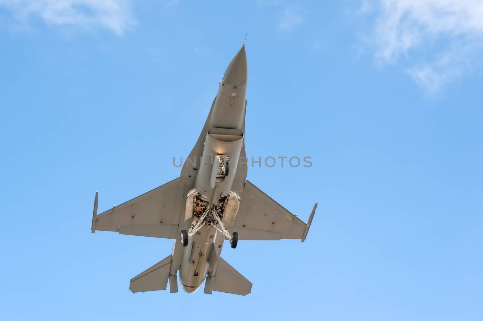 unmarked militay fighter jet on landing approach