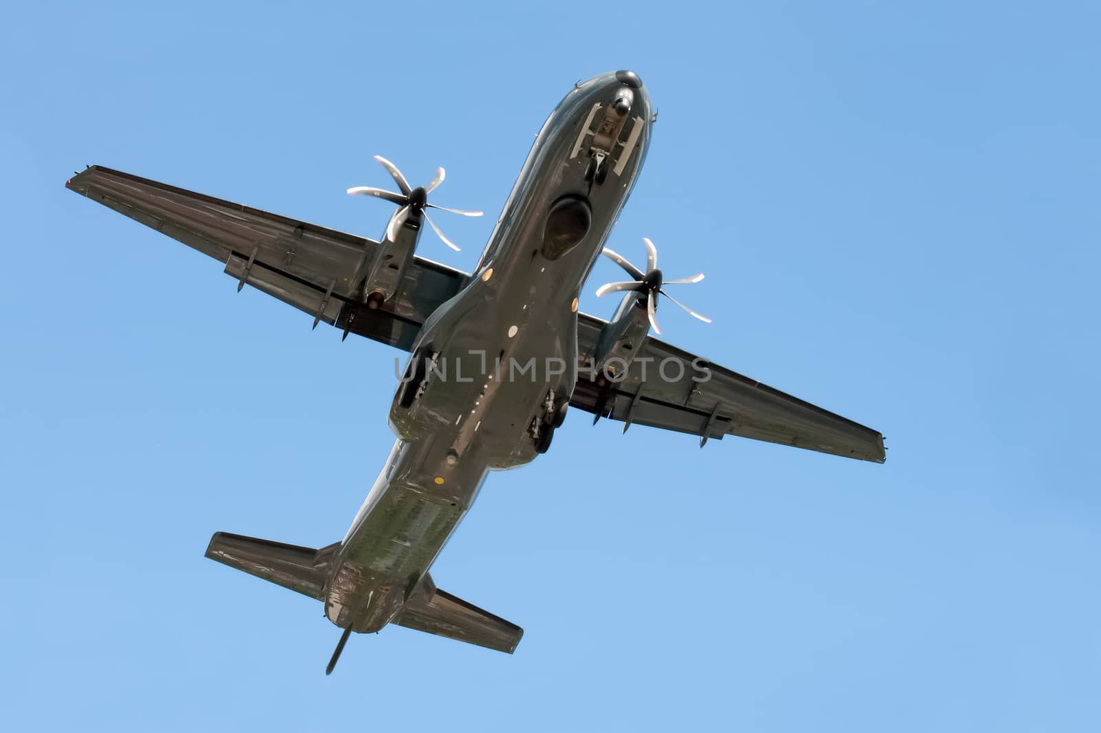 small propeller cargo aircraft on landing approach