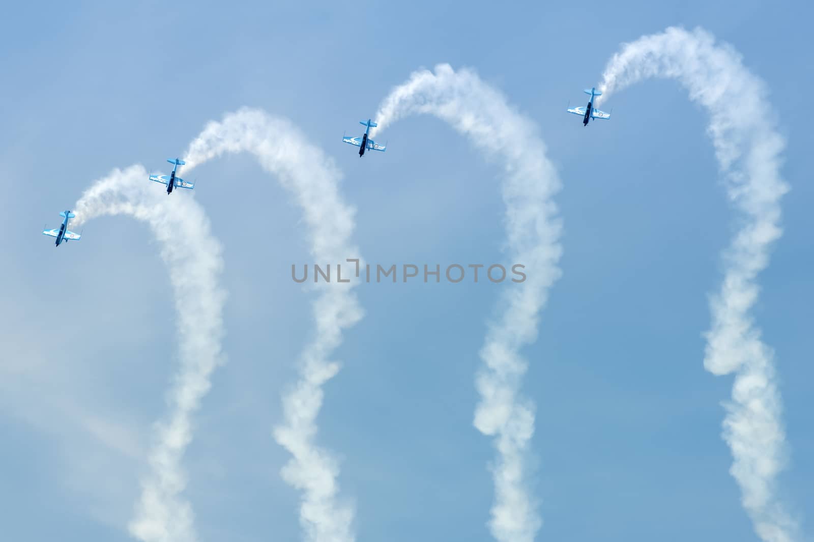 Farnborough, UK - July 19, 2010: Blades aerobatic display team writing question marks in the sky at the Farnborough Airshow, UK