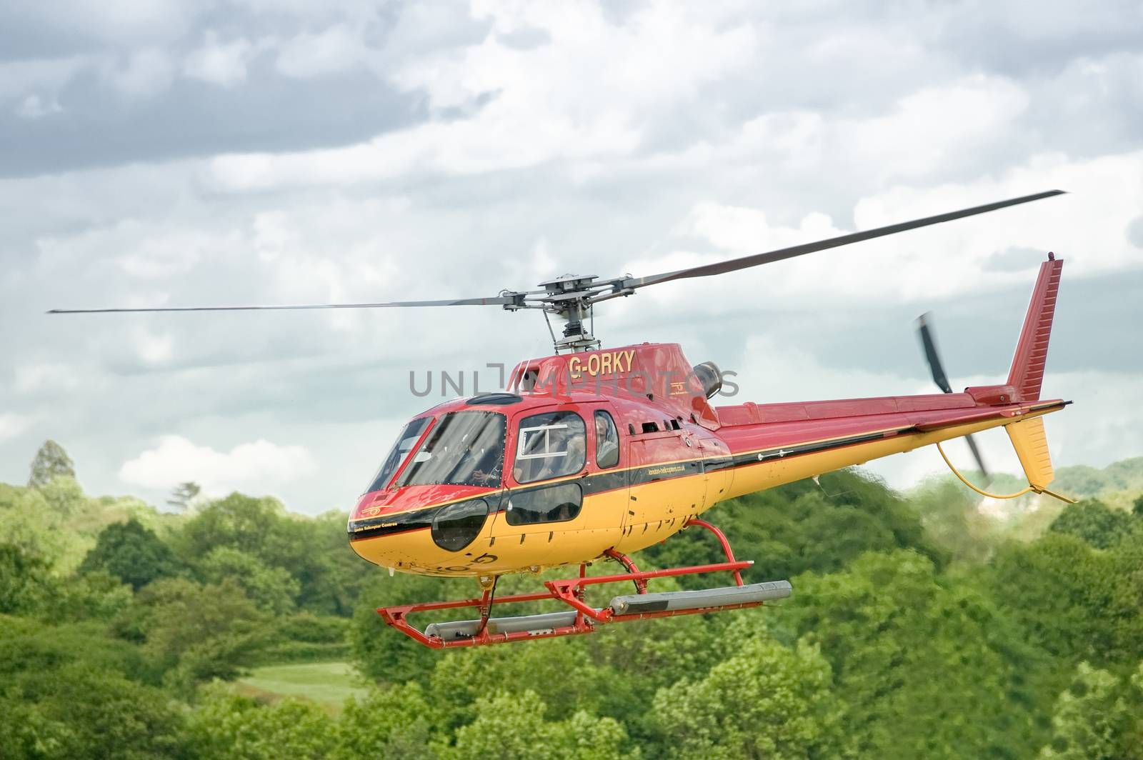 London, UK - May 14, 2011: The popular GORKY tourist helicopter ferrying passengers over the lush countryside surrounding the city of London, UK