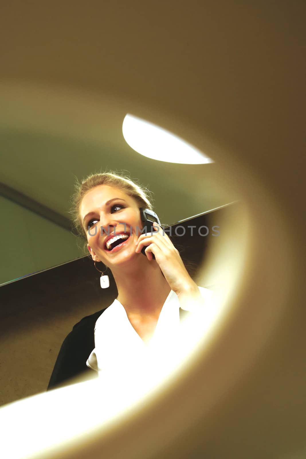 happy young businesswoman talking on mobile phone