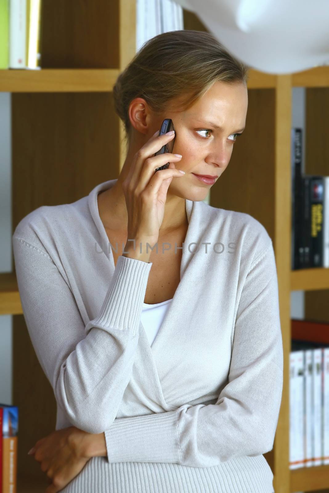 mid adult woman with her mobile phone at home