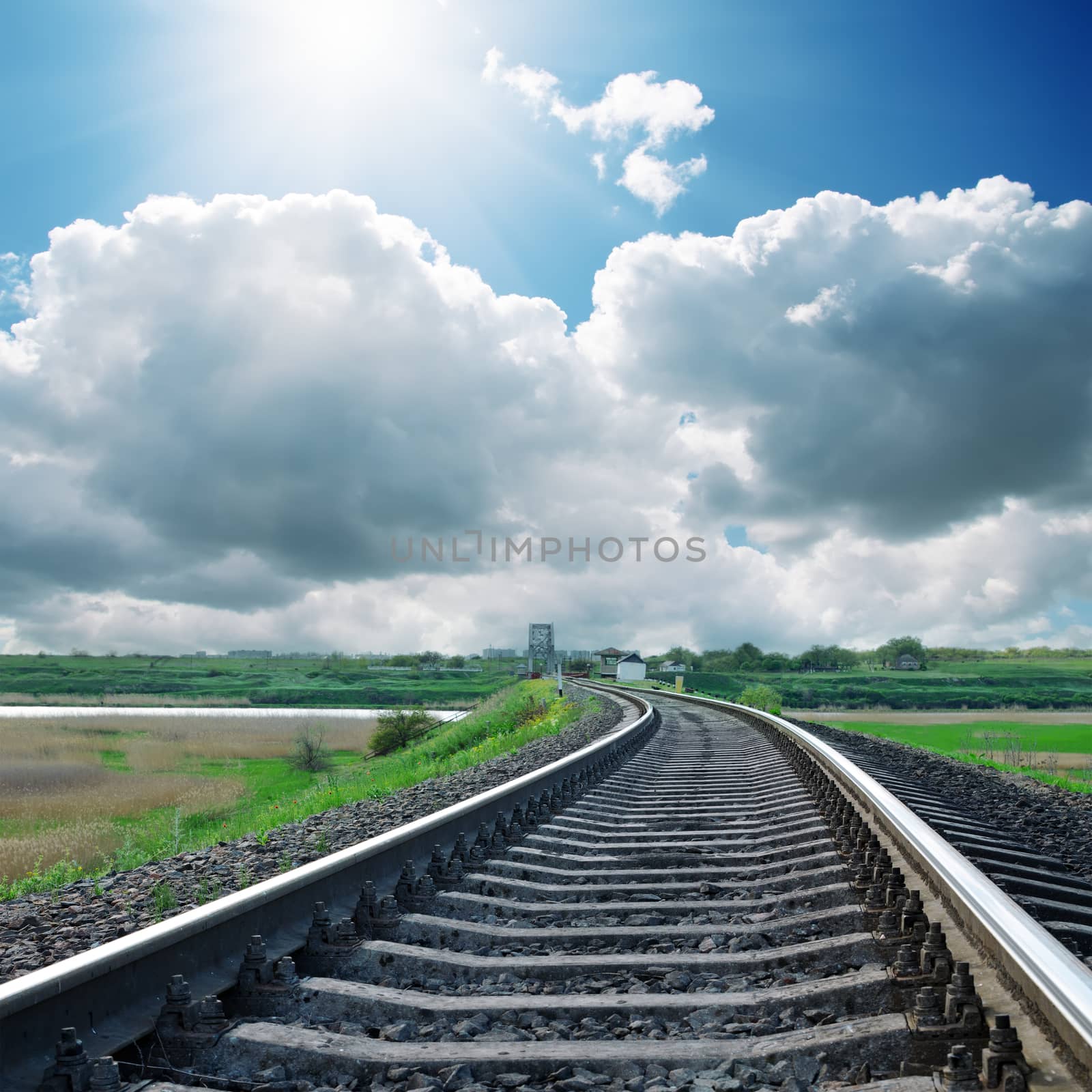 sun over clouds and railroad by mycola
