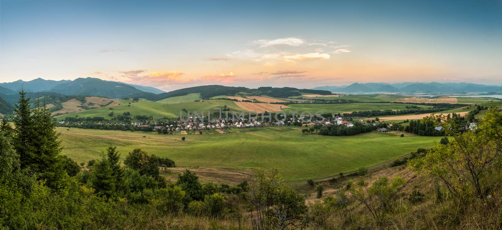 nature landscape with village and mountains, view towards west tatra and low tatra mountains