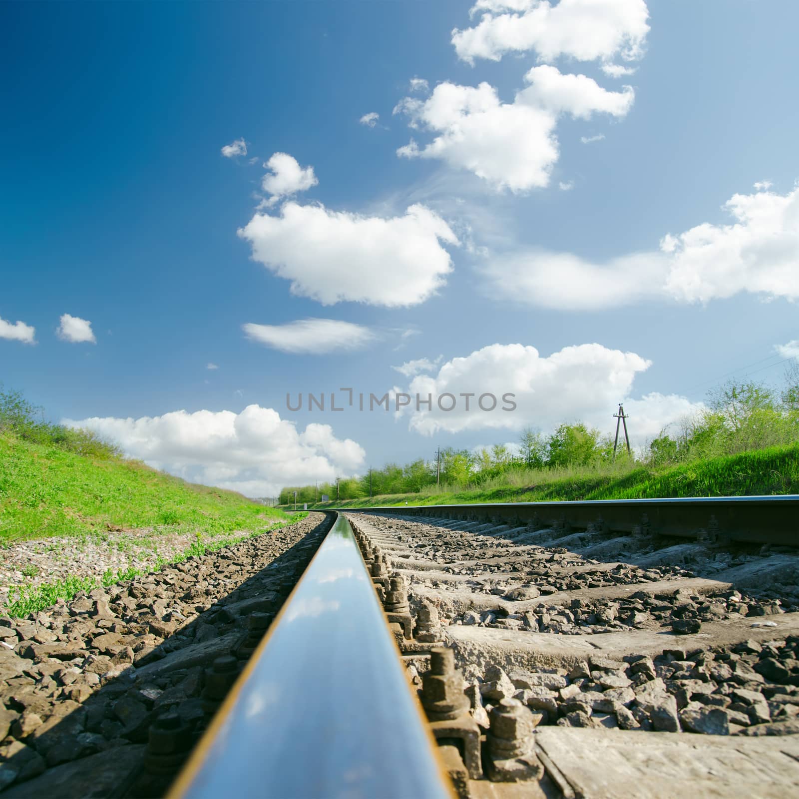 railroad close up and clouds over it