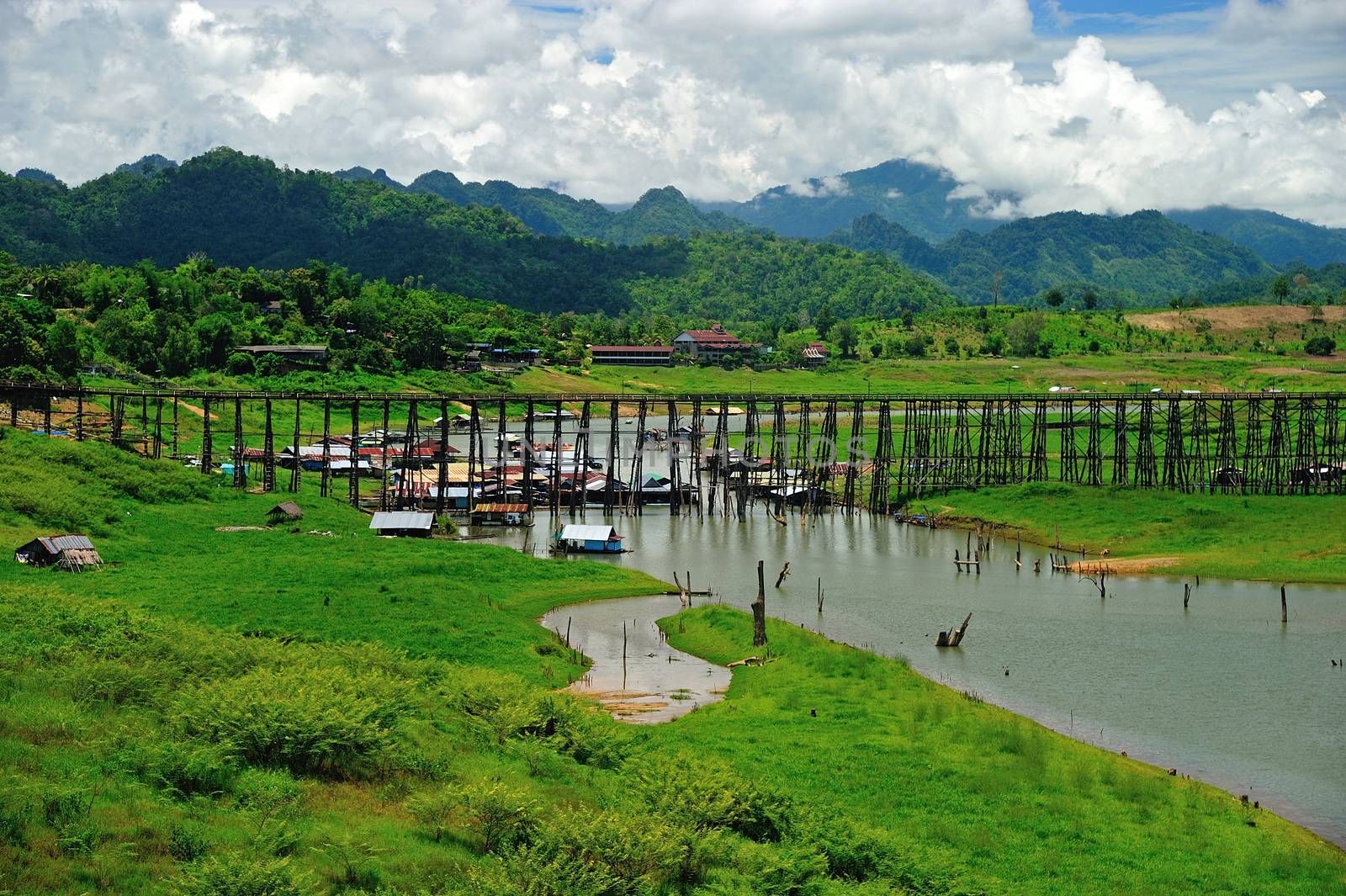 Wood bridge with river and mountain in Kanchanaburi Thailand