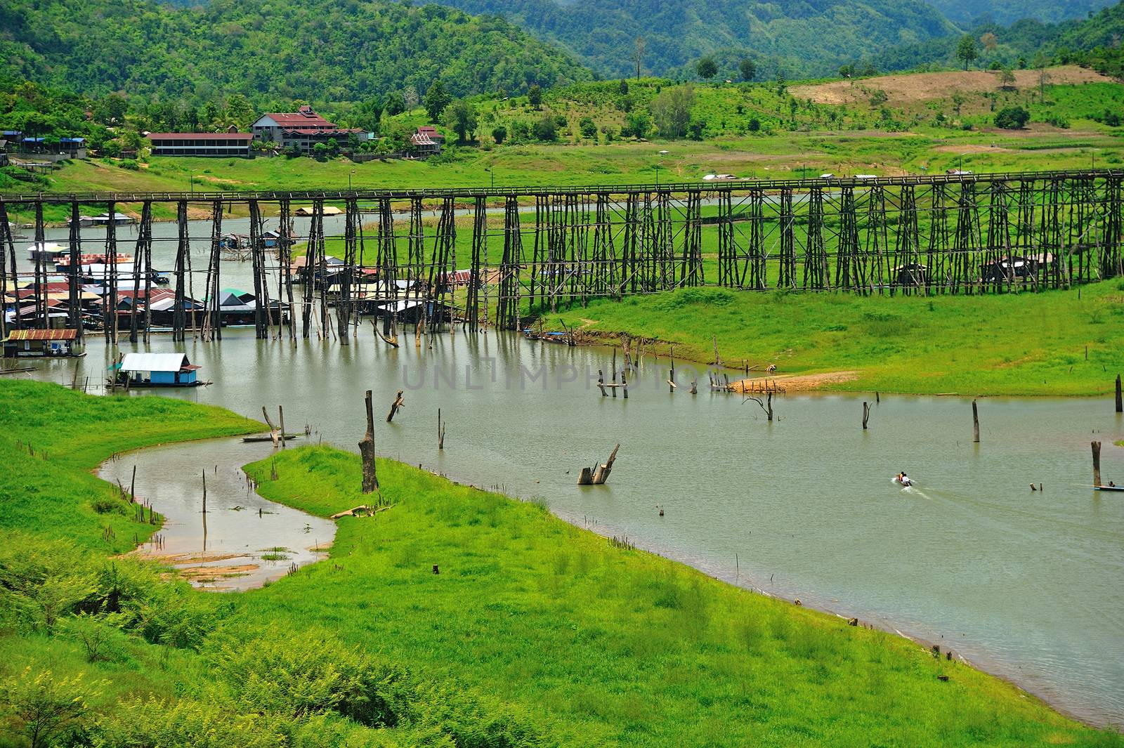 Wood bridge with river and mountain in Kanchanaburi Thailand