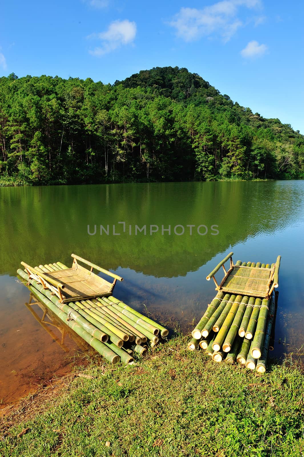 Bamboo raft on Pang Ung reservoir lake, Mae Hong son, Thaialand. by think4photop