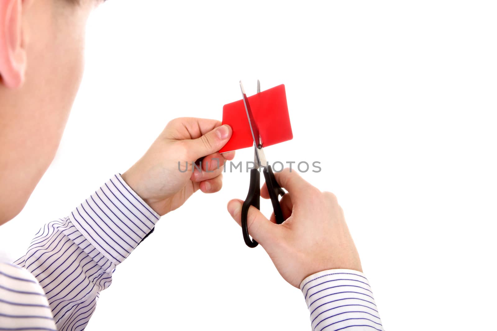 Person cutting a Credit Card Closeup on the White Background