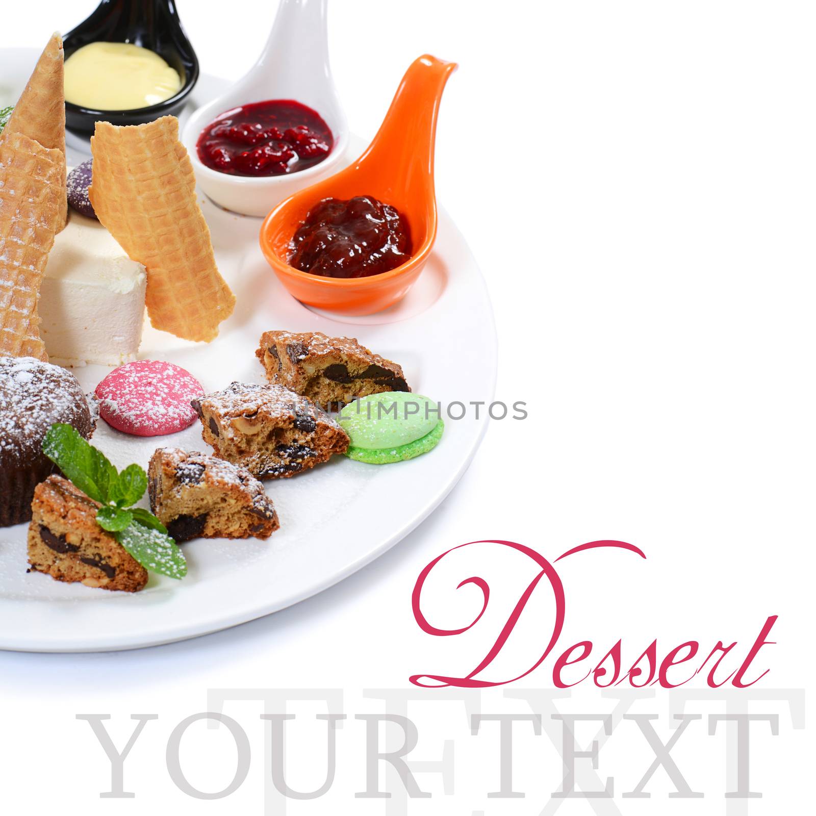 Plate of different desserts isolated on white