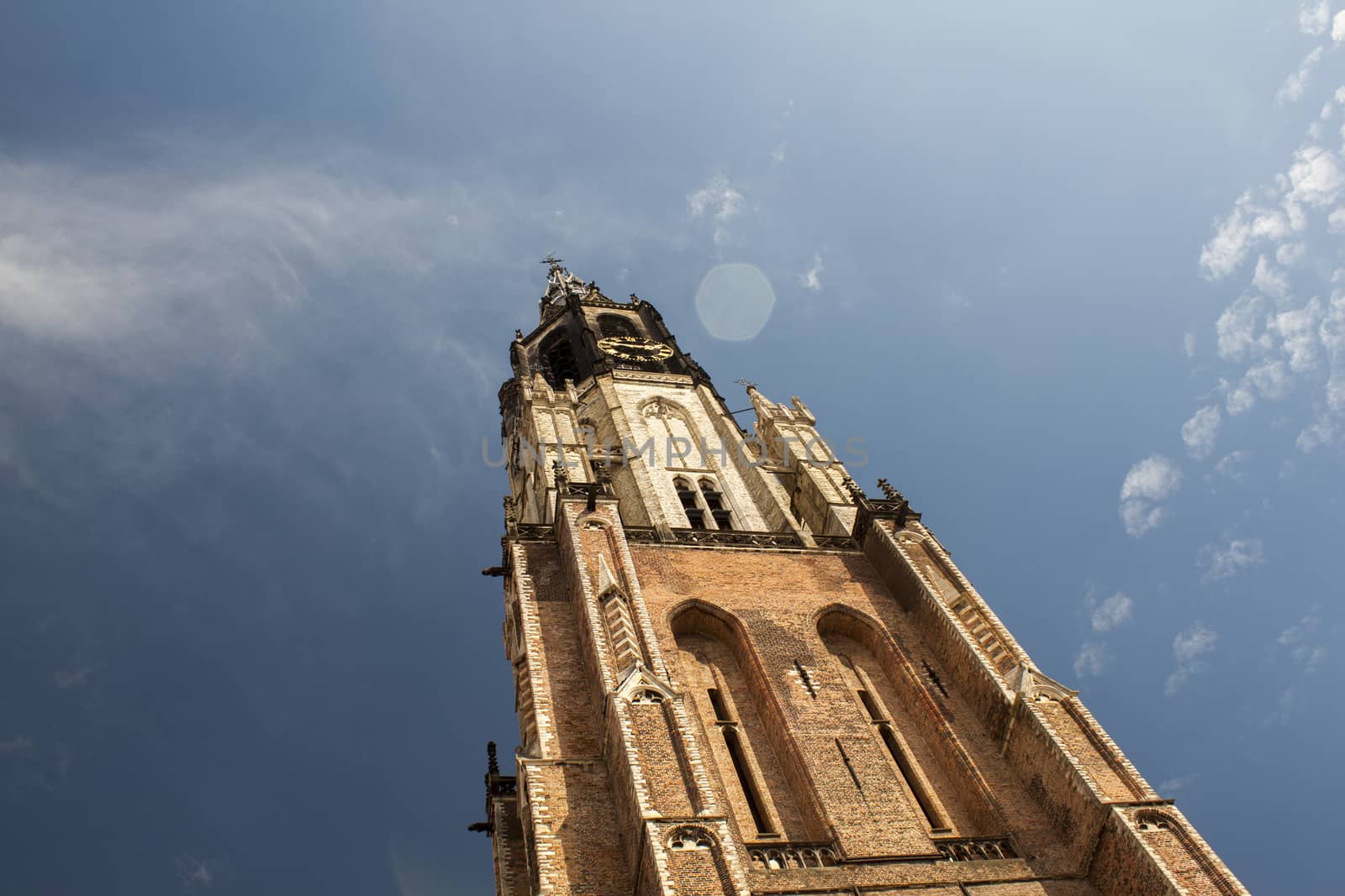 new church tower in delft netherlands with clouds