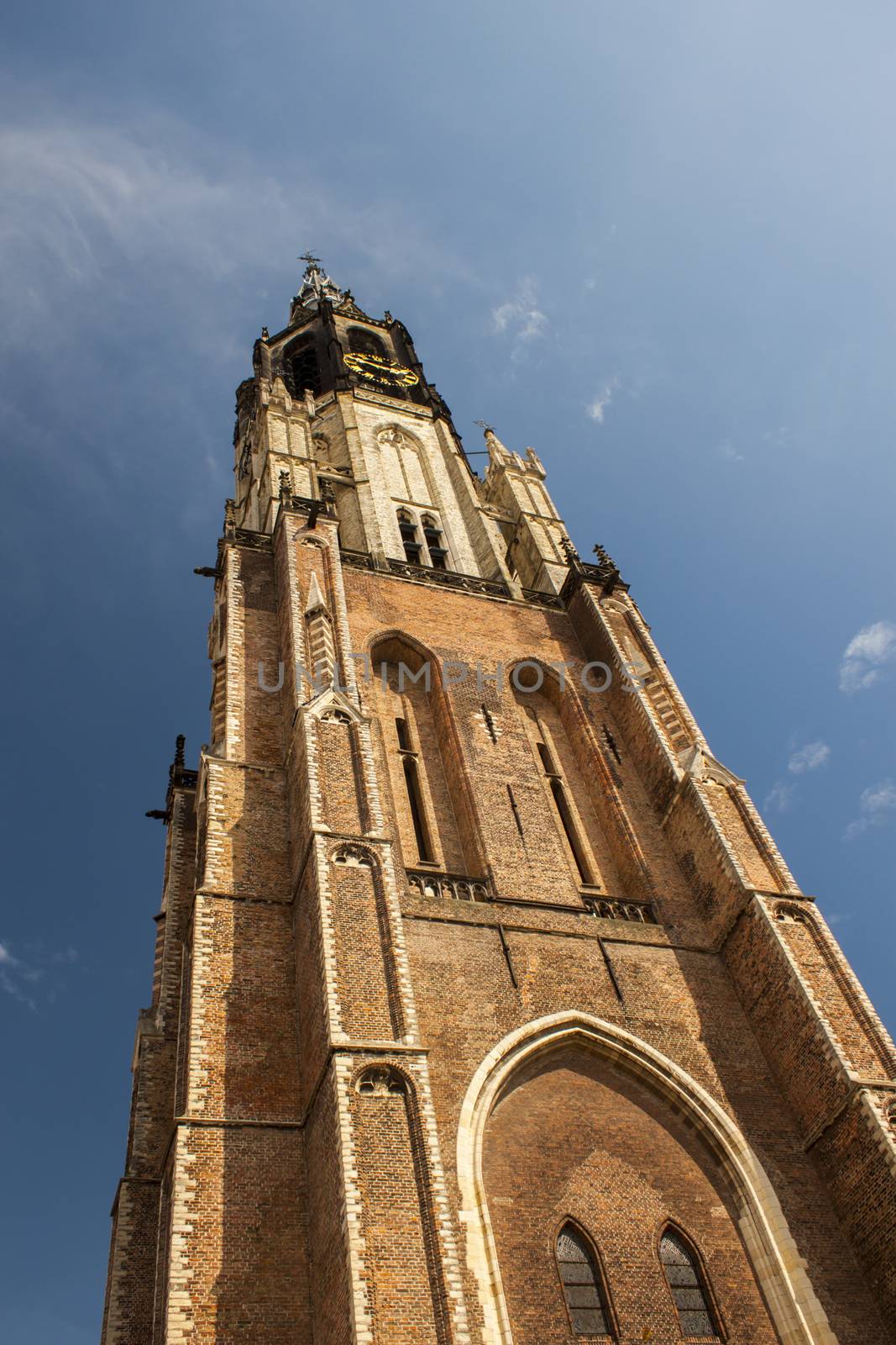 new church tower in delft netherlands with clouds