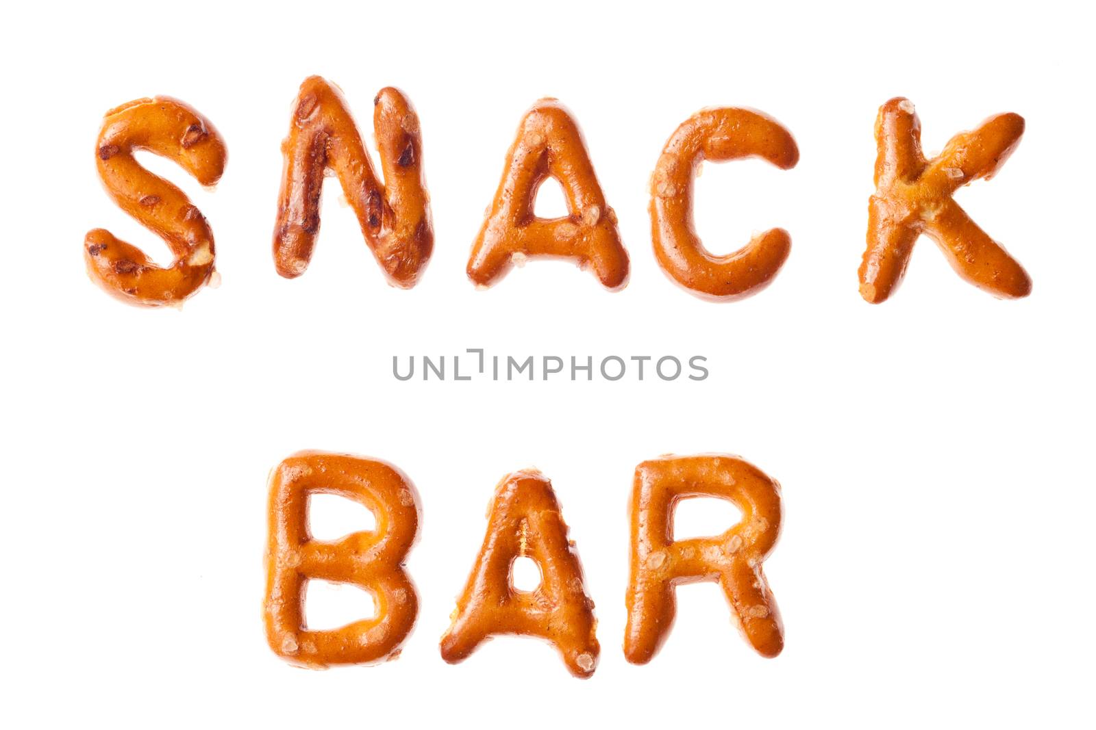 Word SALT written, laid-out, with crispy alphabet pretzels isolated on white background