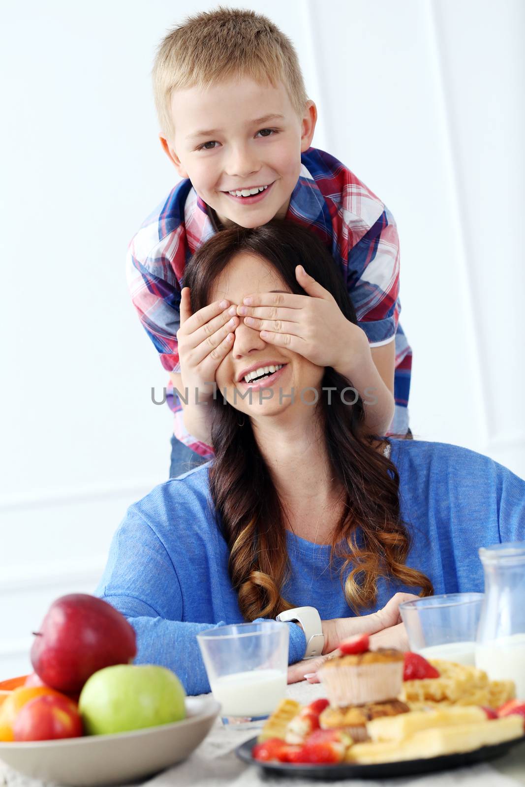 Mother with kid during family breakfast