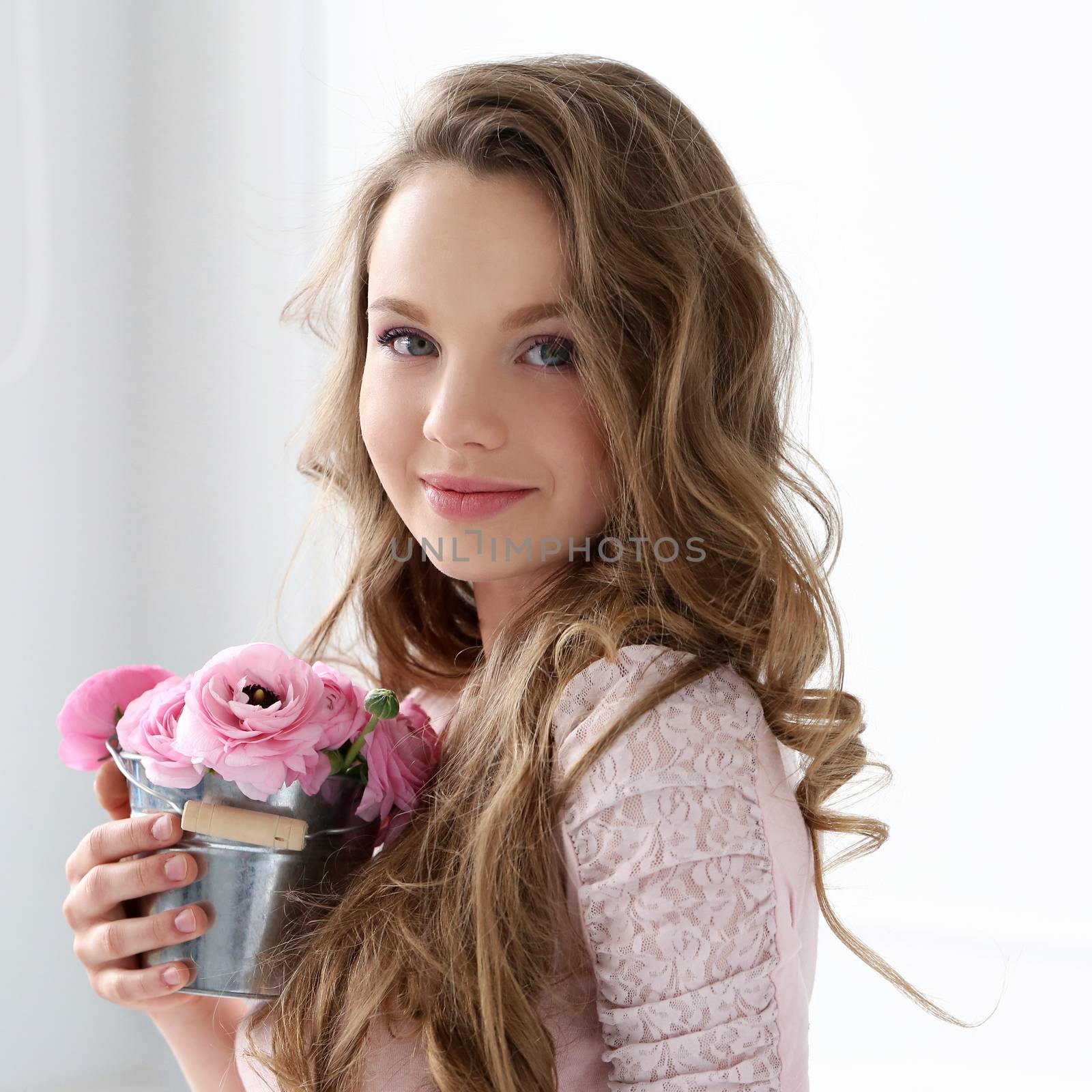 Cute, young girl with flowers