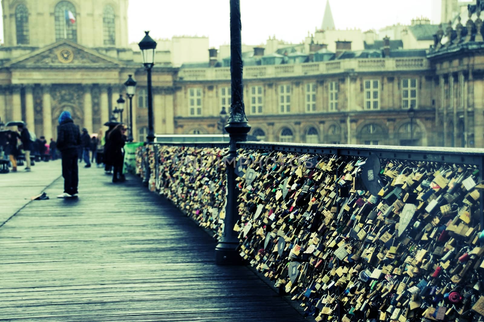 Love Locks on Pont des Arts, the pedestrian bridge in Paris which crosses the River Seine.