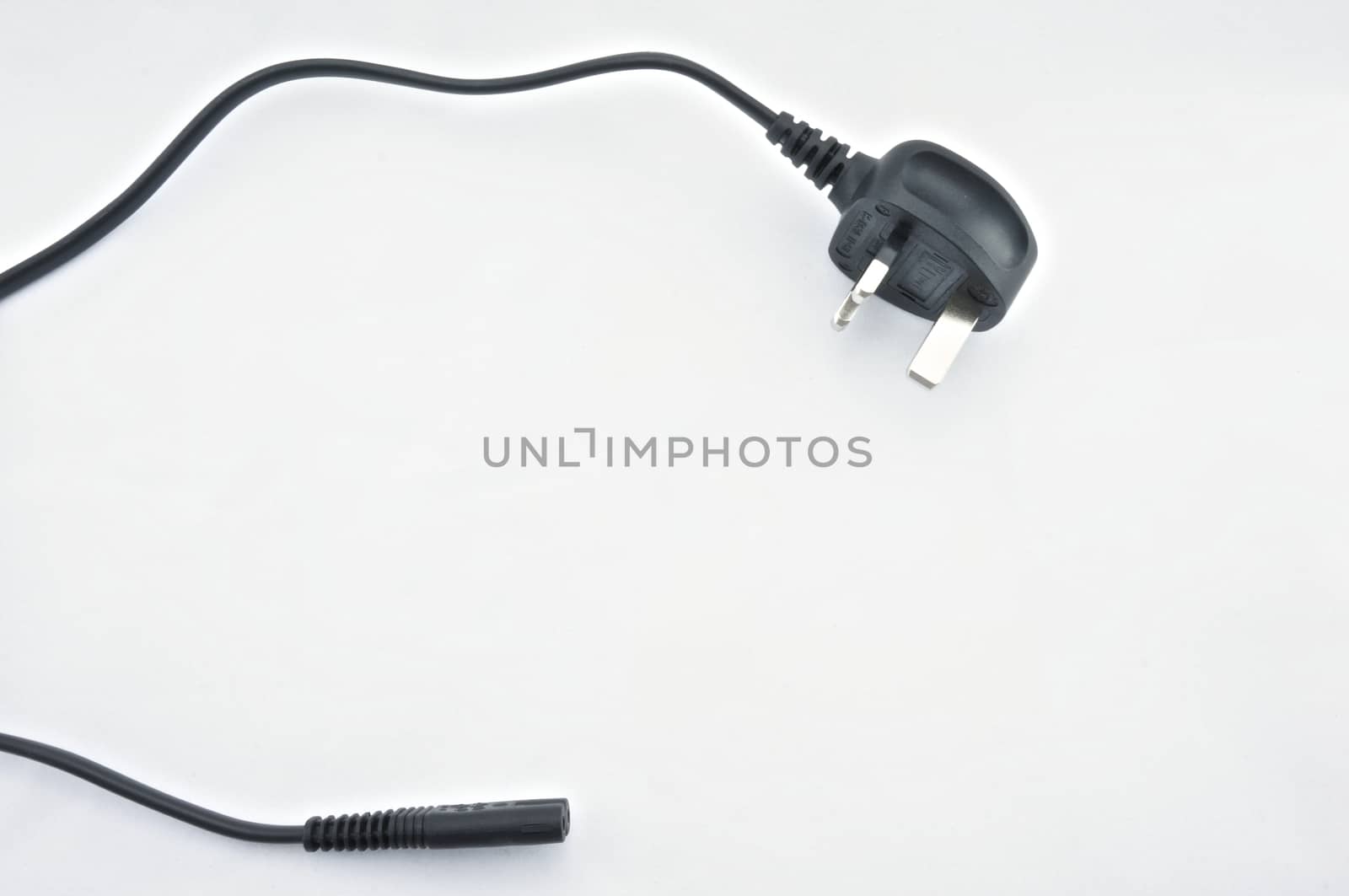 Black plug on white background by eaglesky