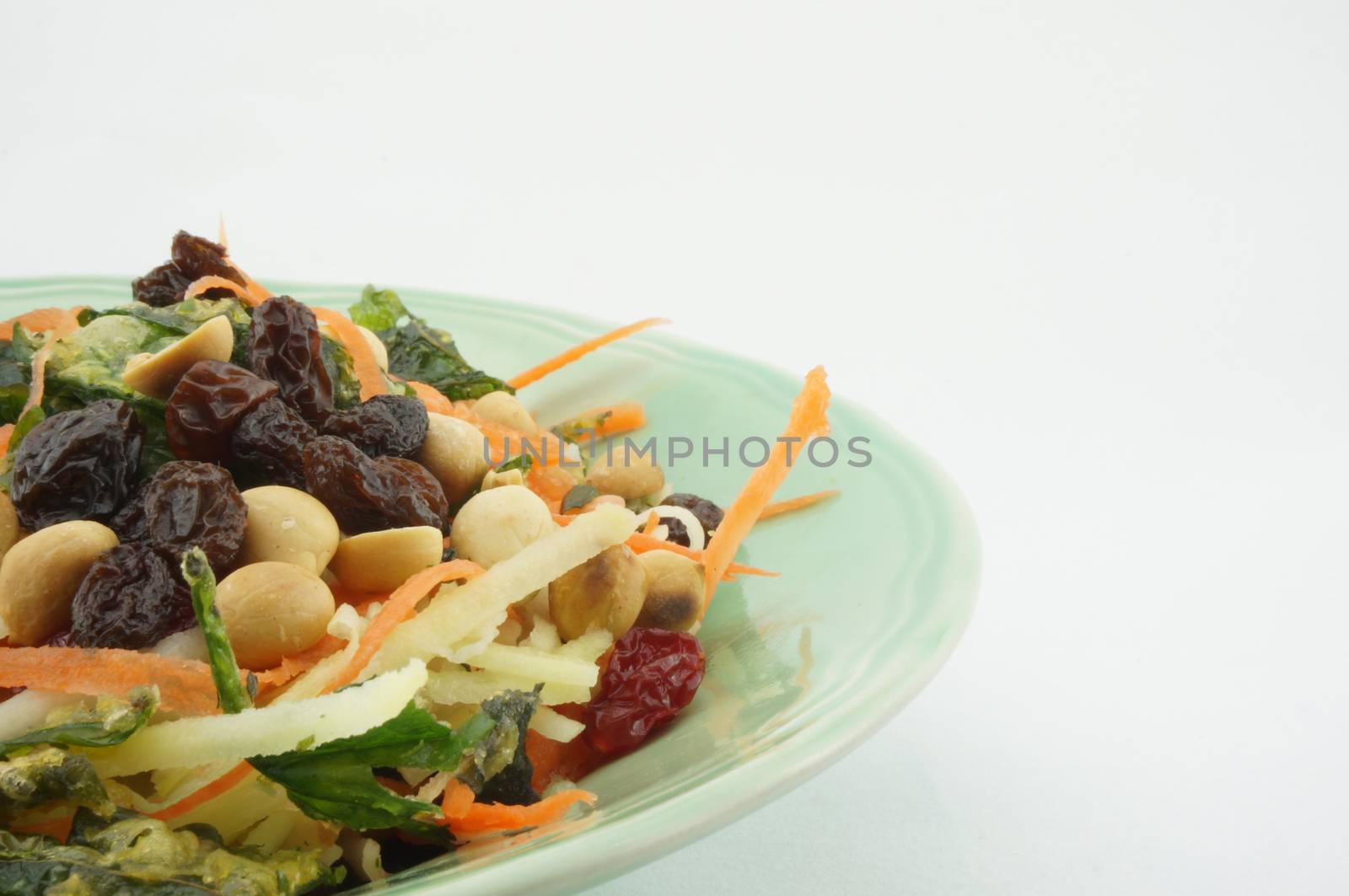 Salad with tomato raisins mango and nut by eaglesky