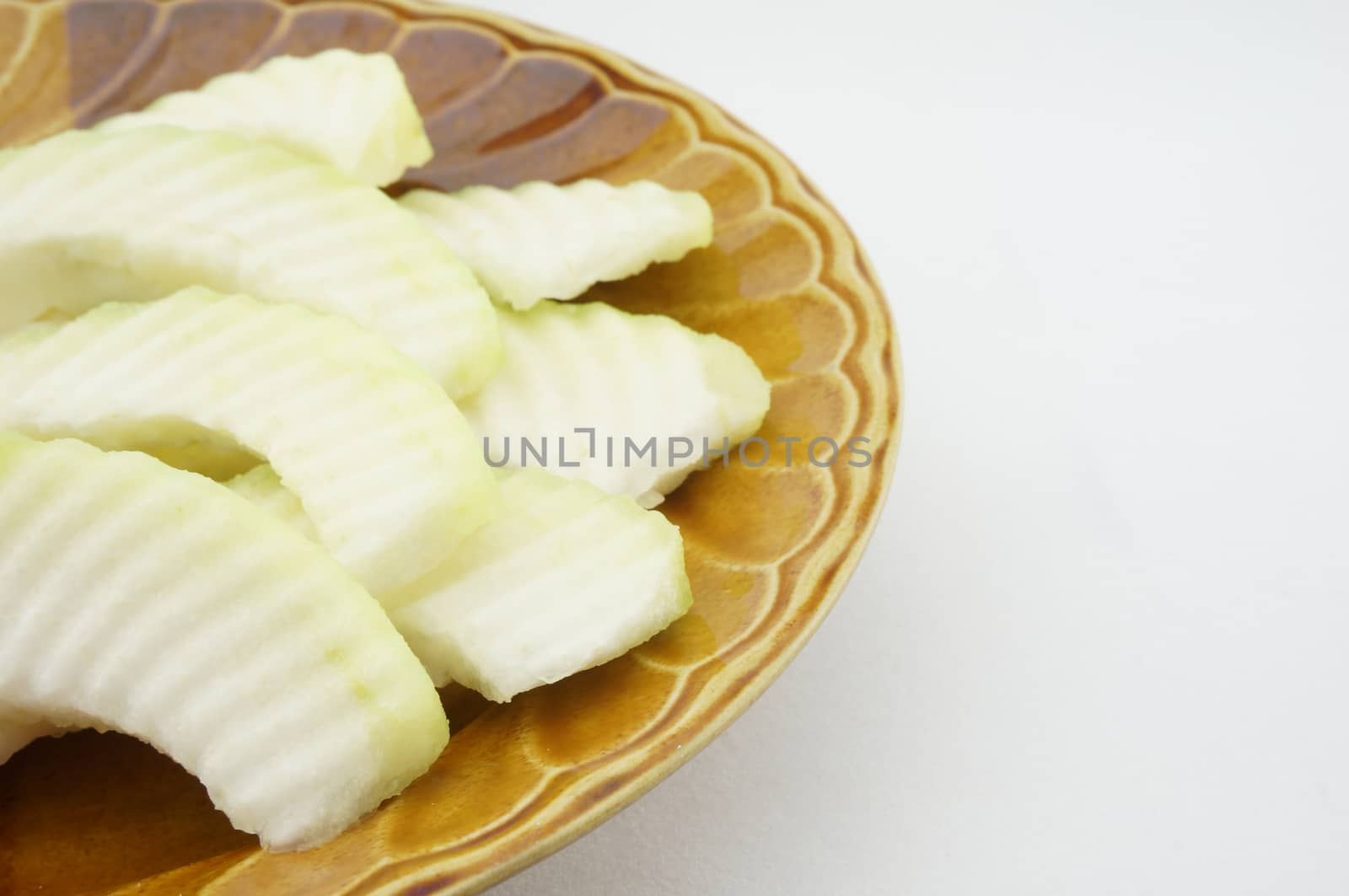 Sliced guava on the plate Brown with white background for diet.