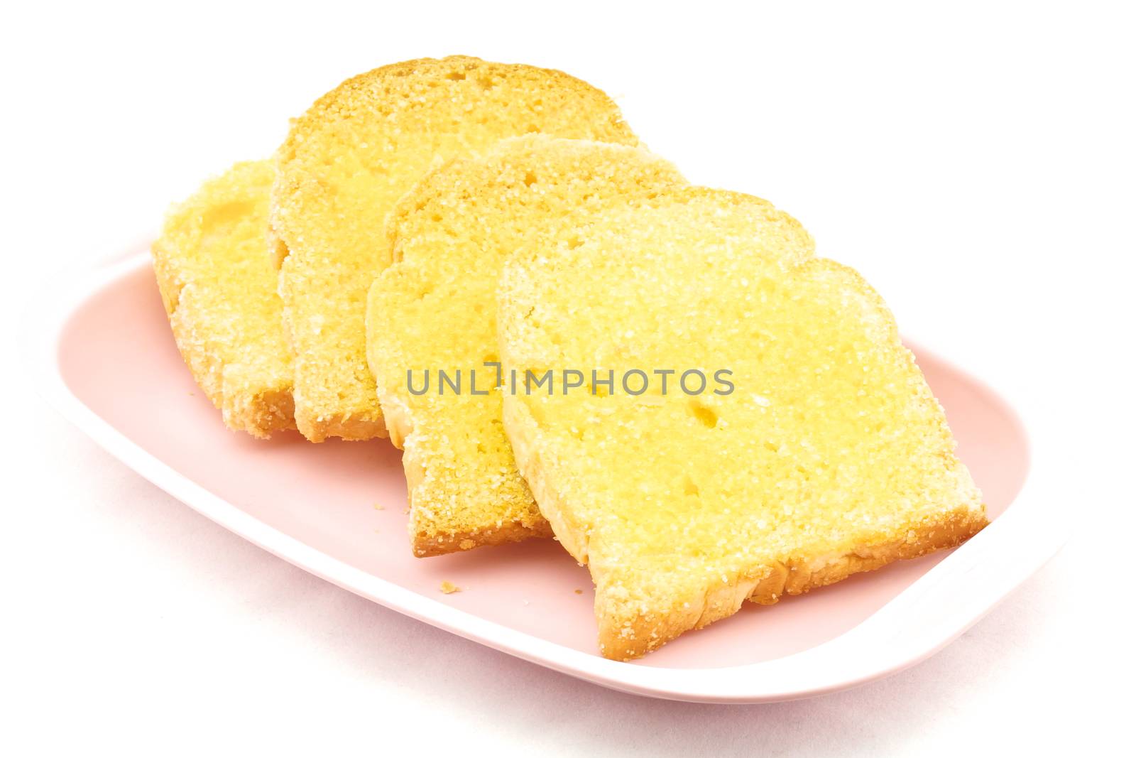 Bread baked with butter and sugar placed in a pink tray on white background.