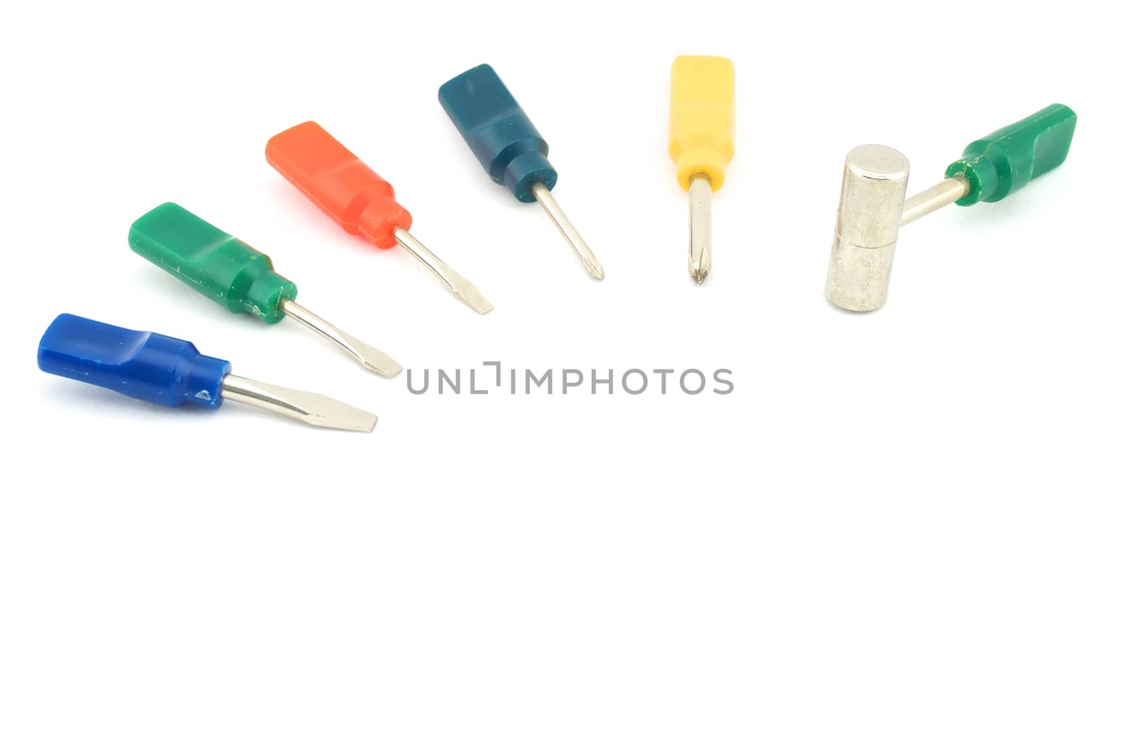 Colorful small screwdriver and a hammer use for minor repair with white background.