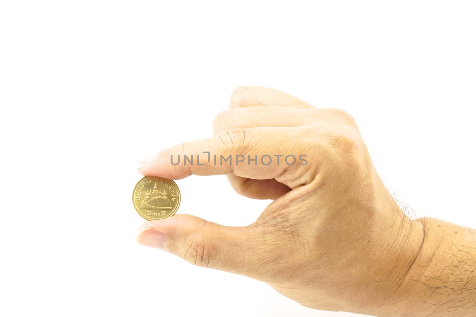 Hand of man holding gold coin on the white background.