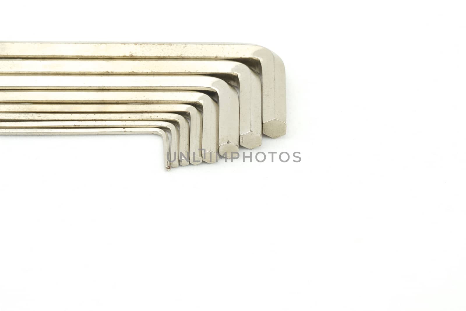 Set of hex keys use for minor repair arranged on white background.