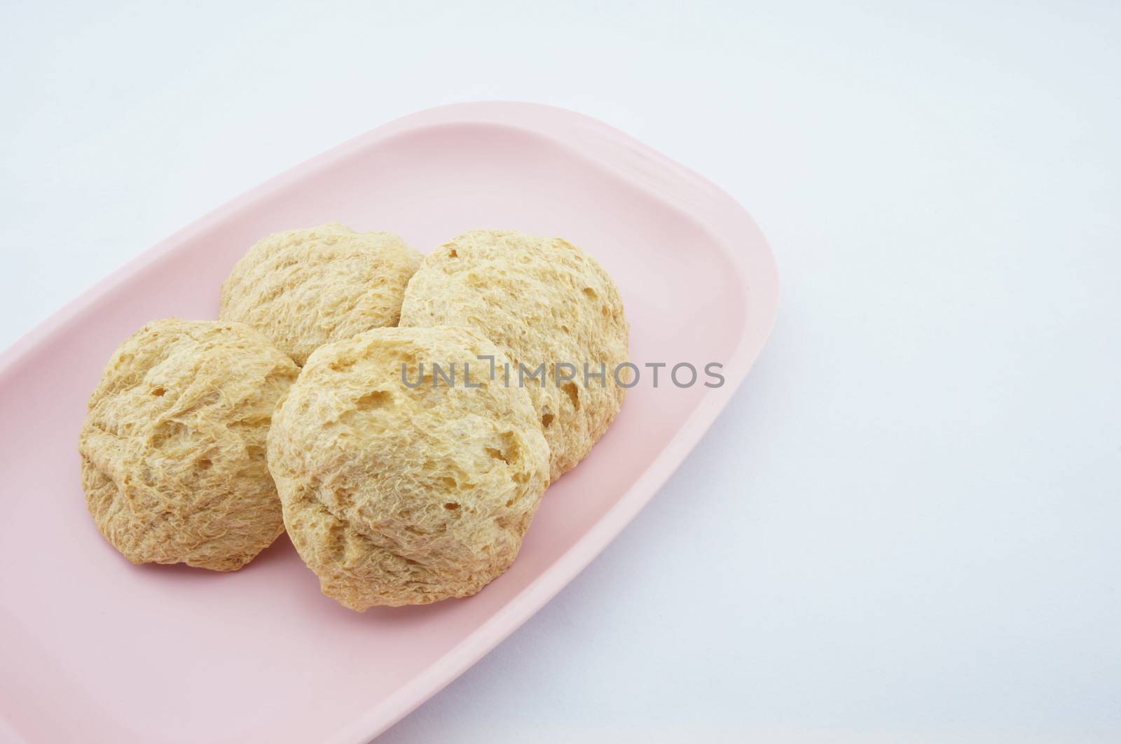 Vegan Protein Dry placed on pink tray with white background.