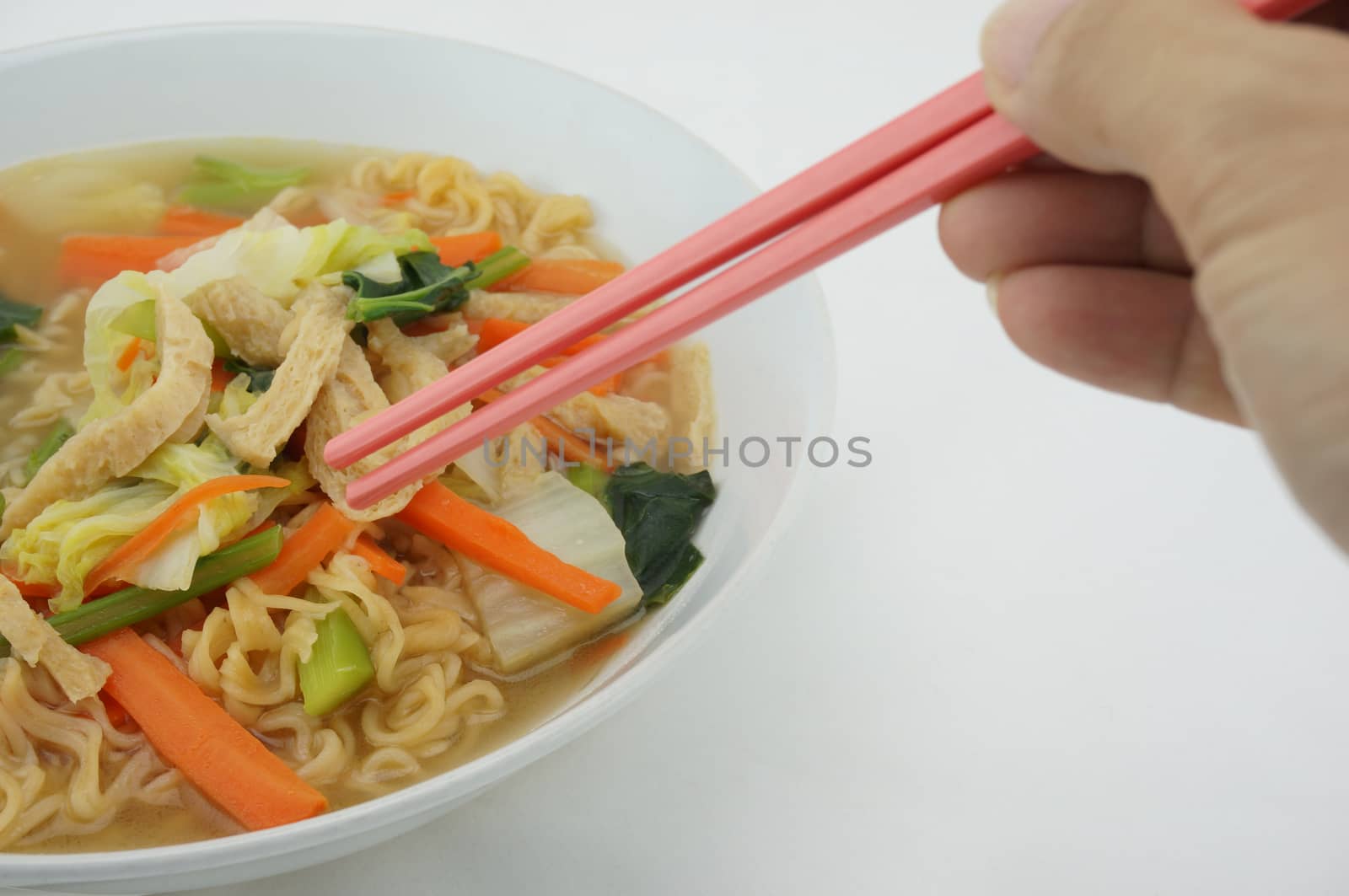 Eating noodle vegetarian with chopsticks by eaglesky