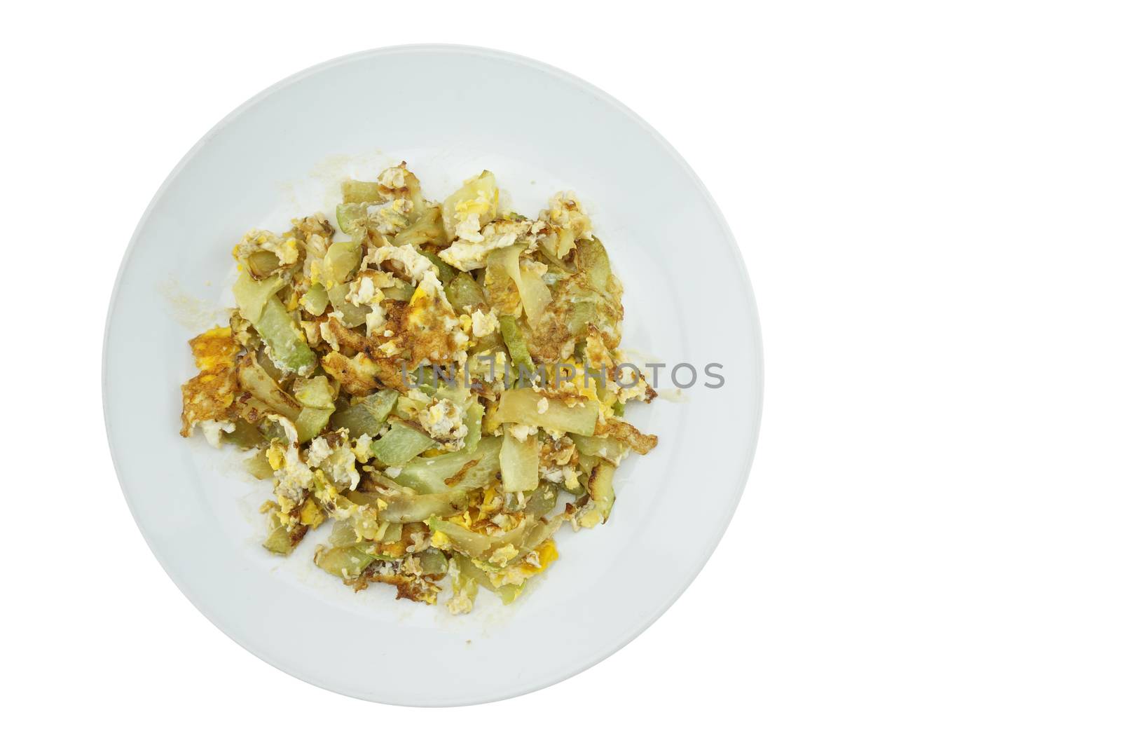 Chayote sliced fried with egg on white dish with white background.