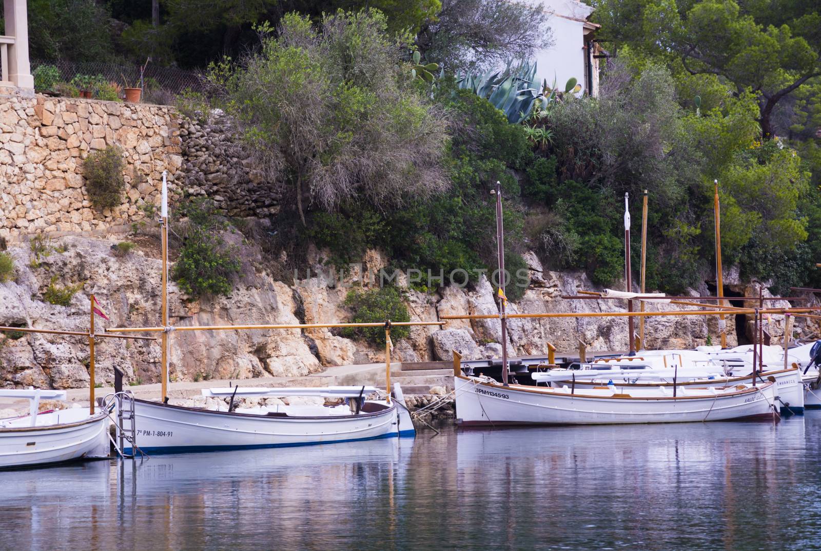 CALA FIGUERA, MALLORCA, BALEARIC ISLANDS, SPAIN ON NOVEMBER 3 2013: Small Majorquin boats (llauts) moored in small harbor on November 3 2013, in Cala Figuera, Mallorca, Balearic islands, Spain.