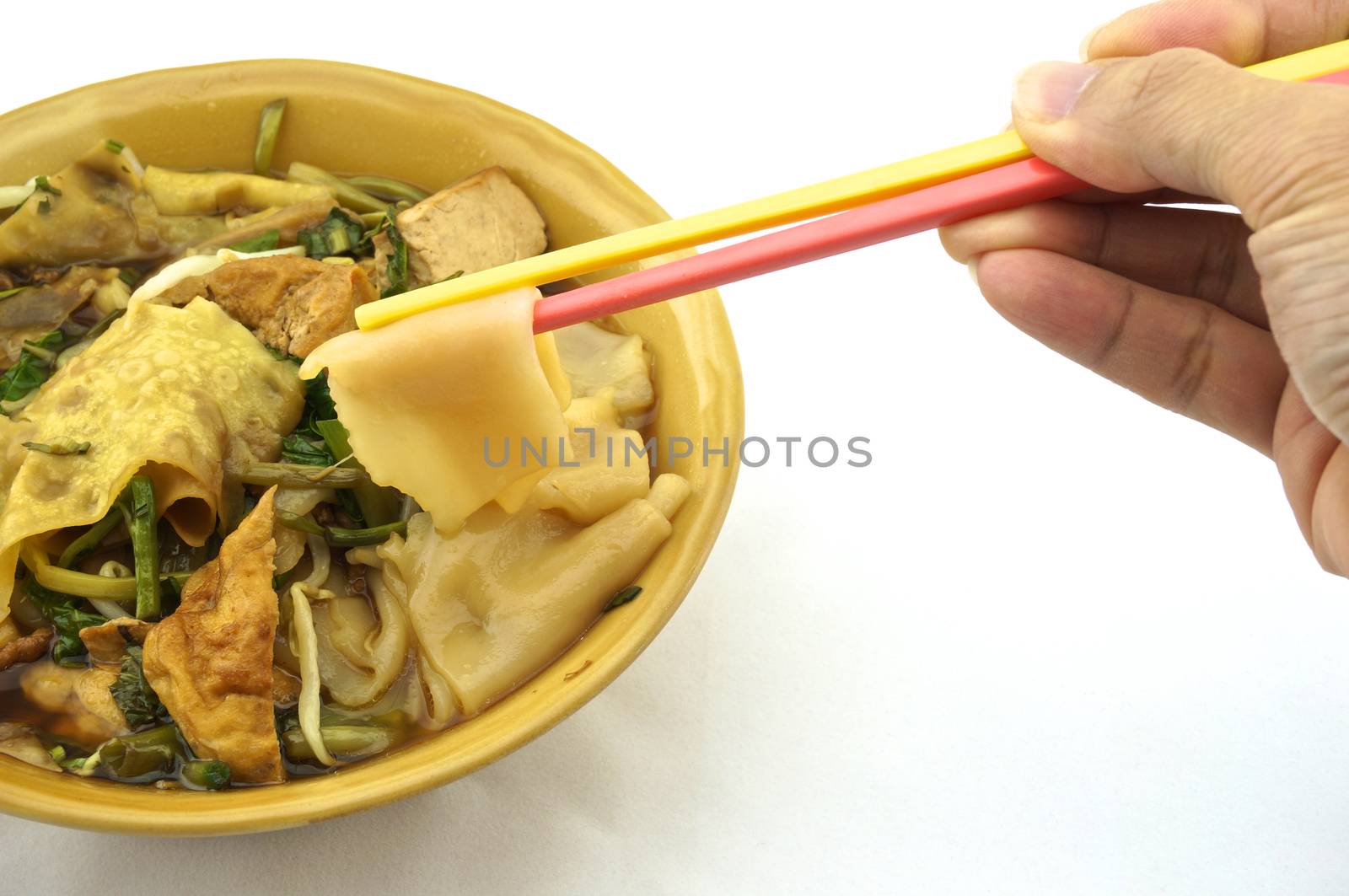 Eating soup white rice noodle with fried tofu, bean sprouts, morning glory vegetarian for health.