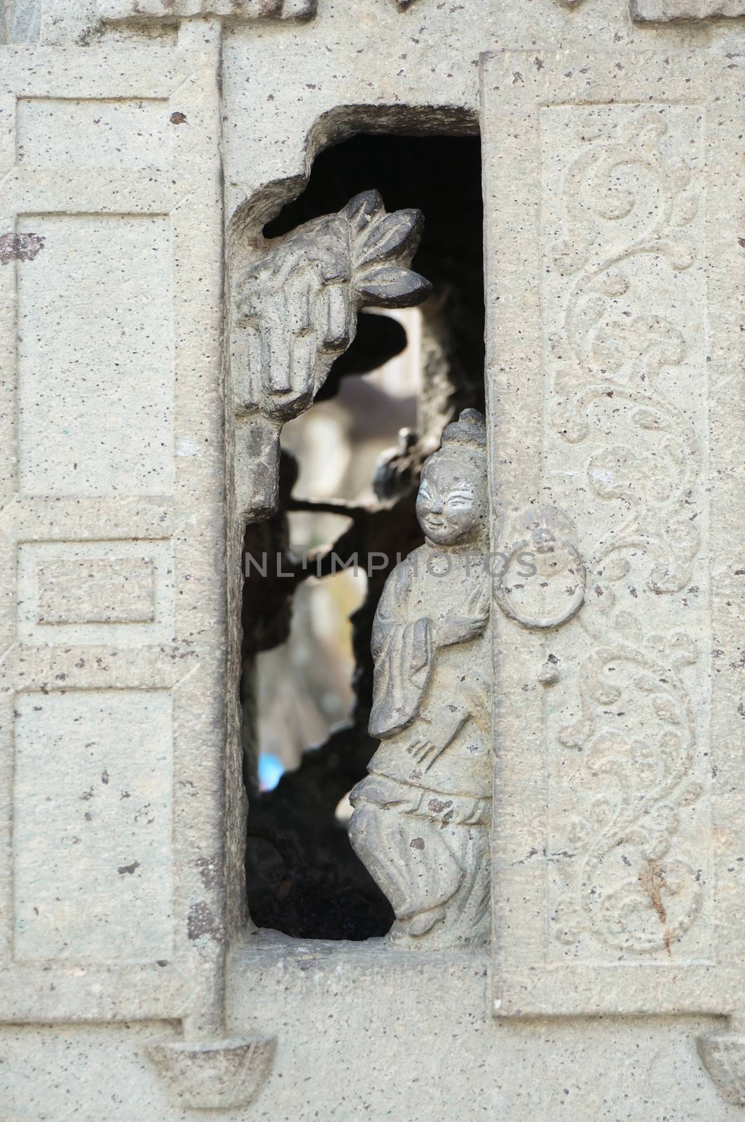 Smile girl stand at door of old stone kiln Wat Pho Thailand. 