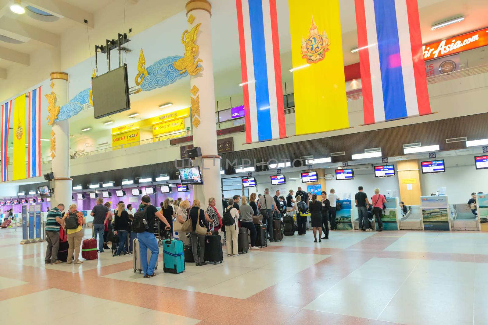  Passenger queue near check-in desks in airport by iryna_rasko