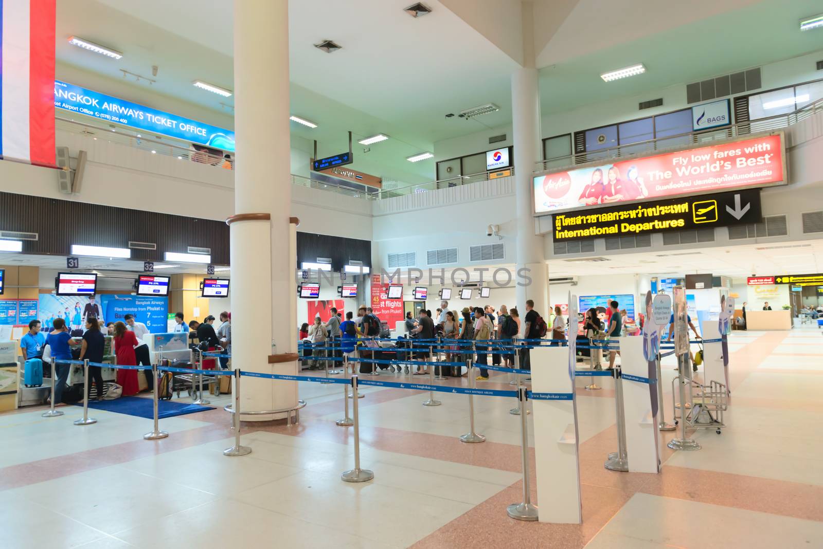  Passenger queue near check-in desks in airport by iryna_rasko