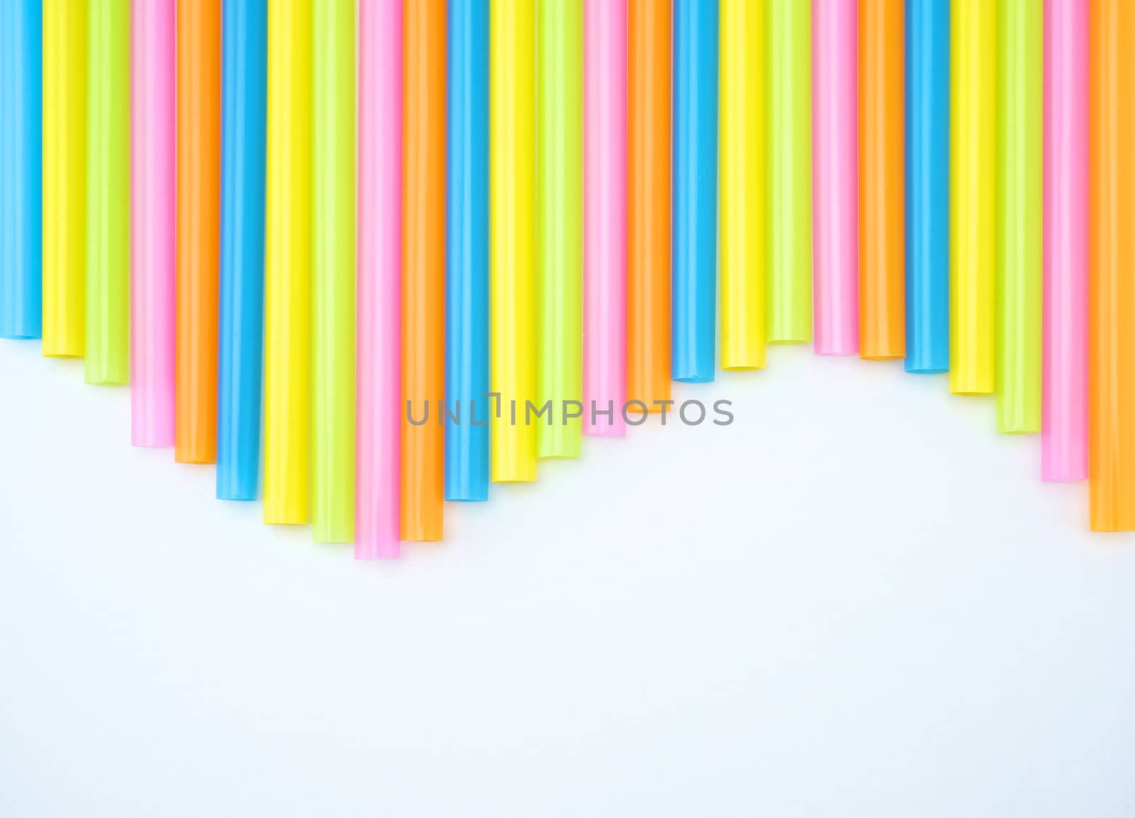 Colorful straight straw put continual as the beautiful background color look like wave.