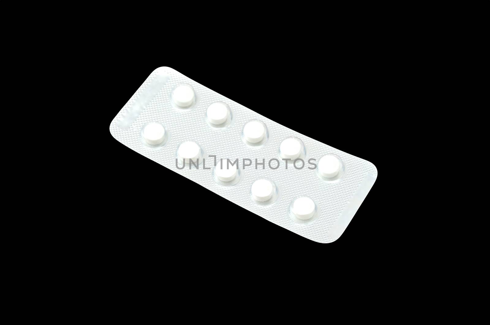 White tablets isolated on black background by eaglesky