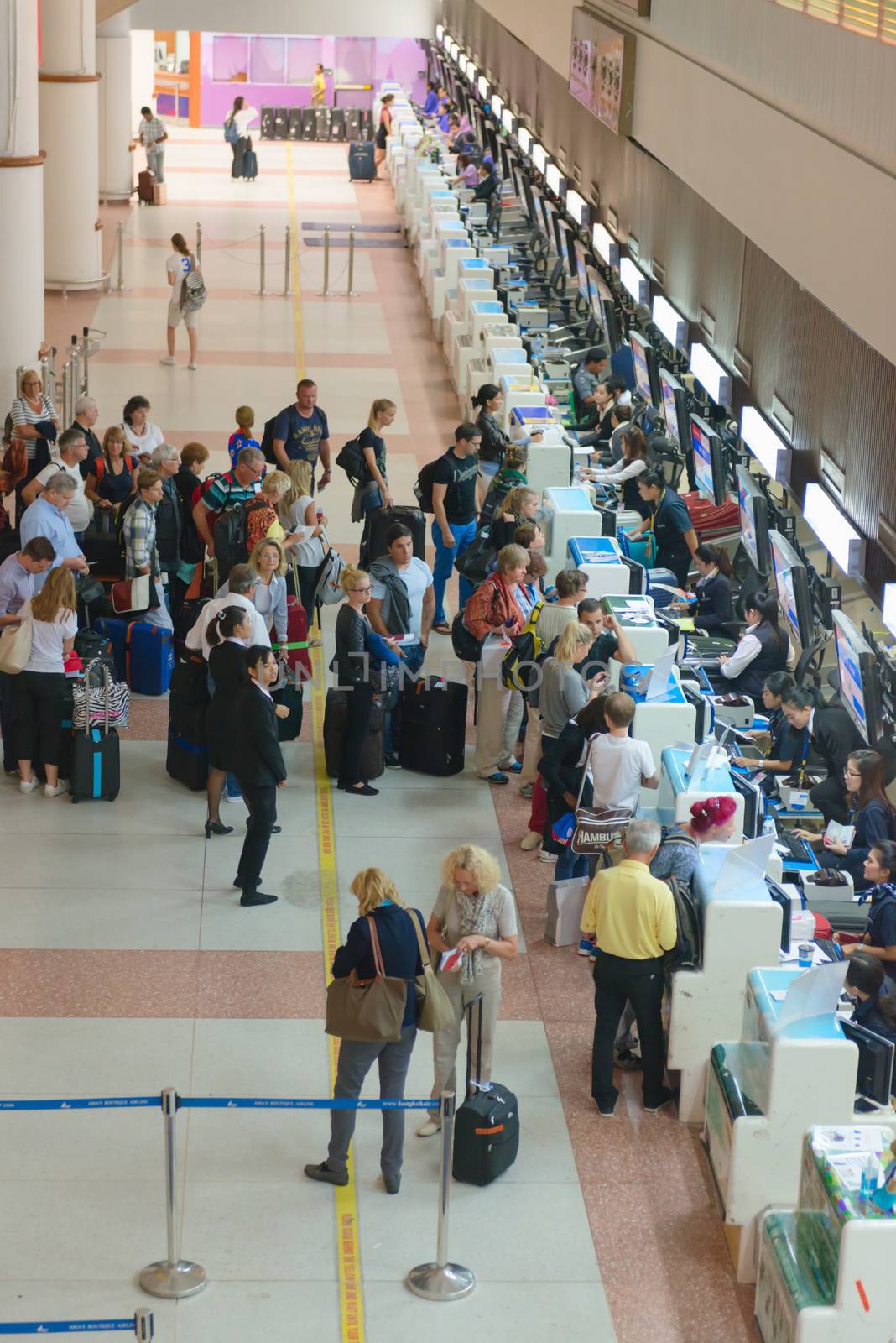 PHUKET, THAILAND - 21 NOV 2013: Passenger queue near check-in desks in Phuket international airport
