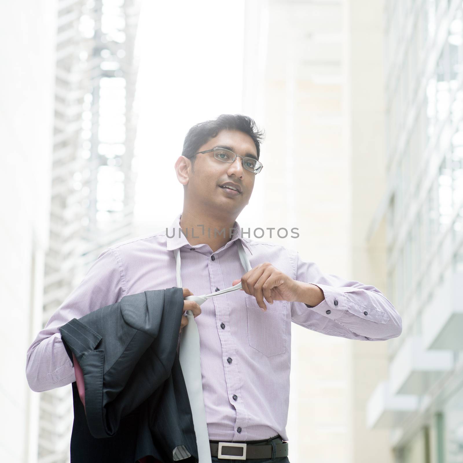  Indian businessman taking off his tie by szefei
