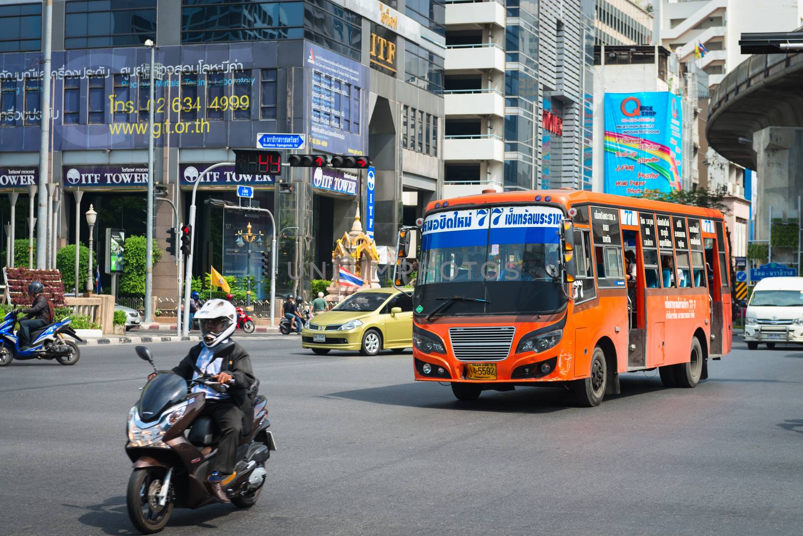 Public transport bus and motorbike on Bangkok treet by iryna_rasko