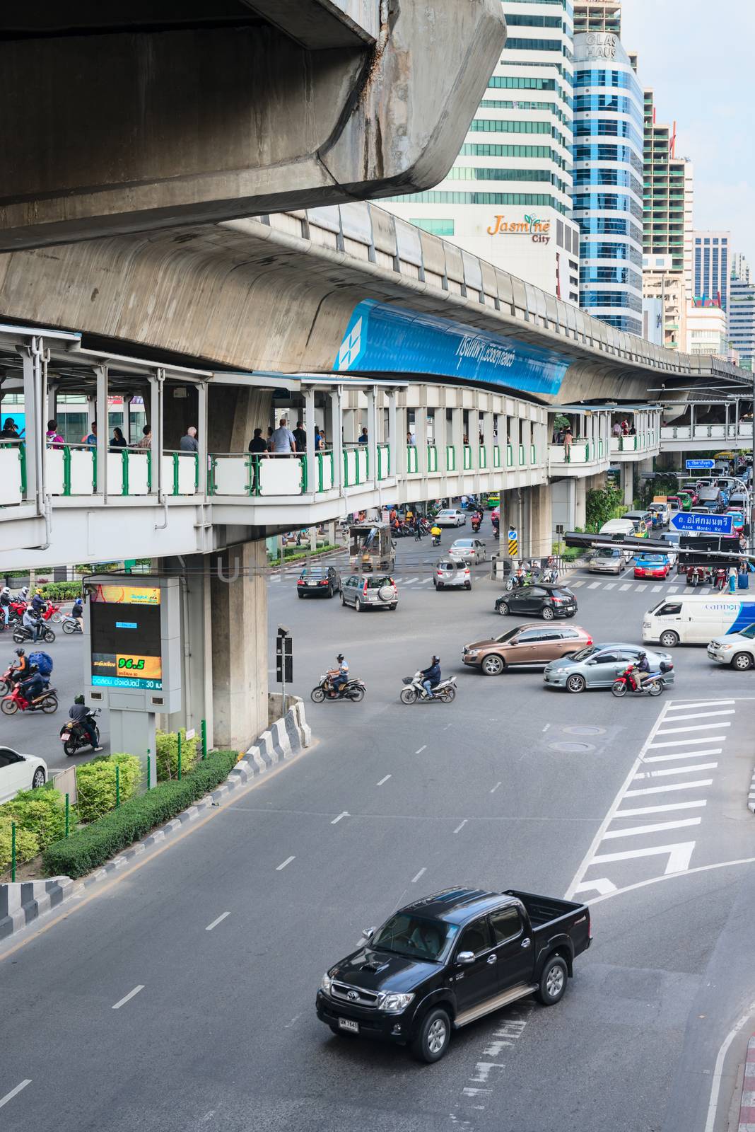 Multilevel Bangkok with traffic on street, pedestrian and SkyTra by iryna_rasko
