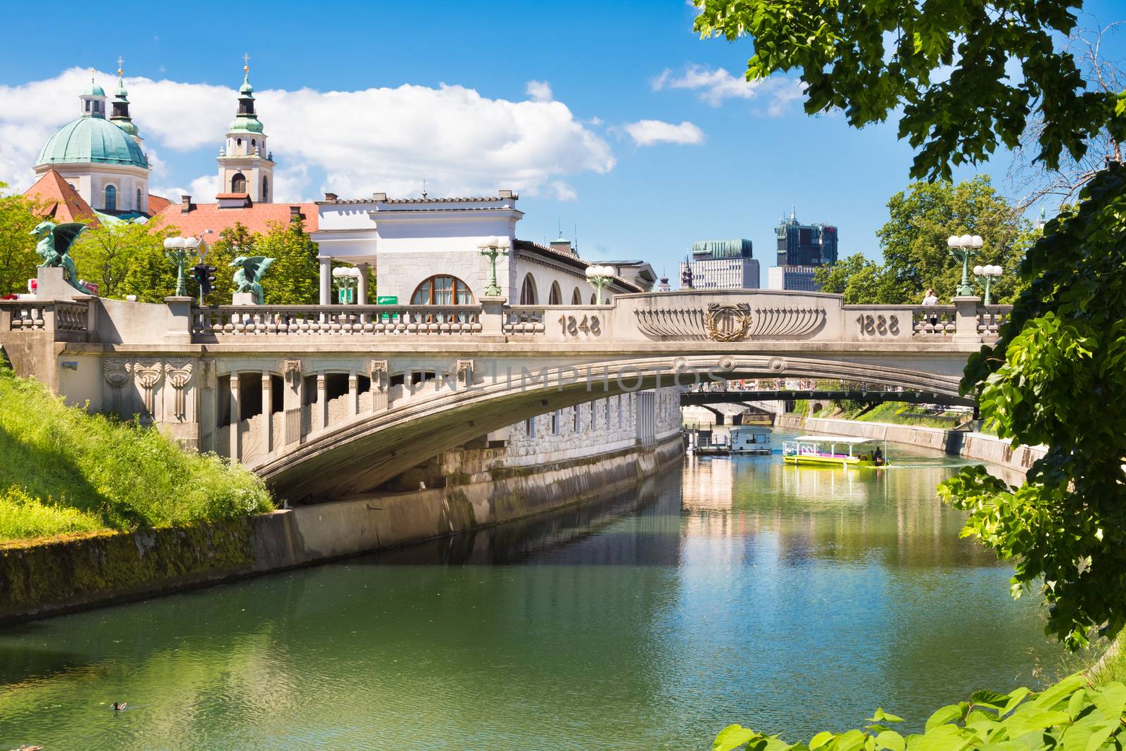 Cityscape of the Slovenian capital Ljubljana. Dragon bridge over Ljubljanica river.