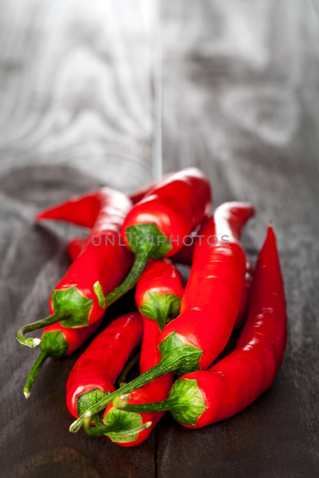 Red chilli pepper on wooden table background