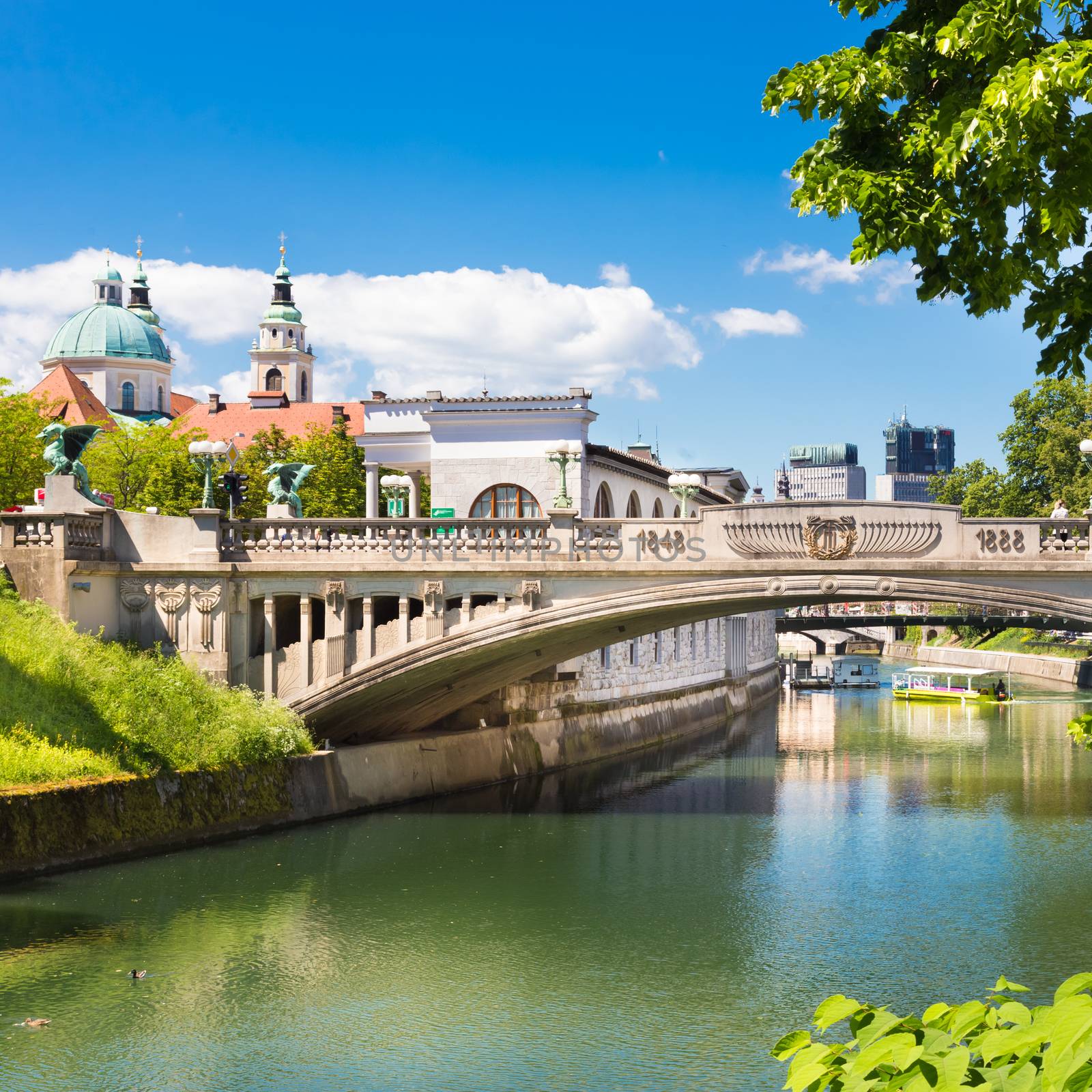 Cityscape of the Slovenian capital Ljubljana. Dragon bridge over Ljubljanica river.