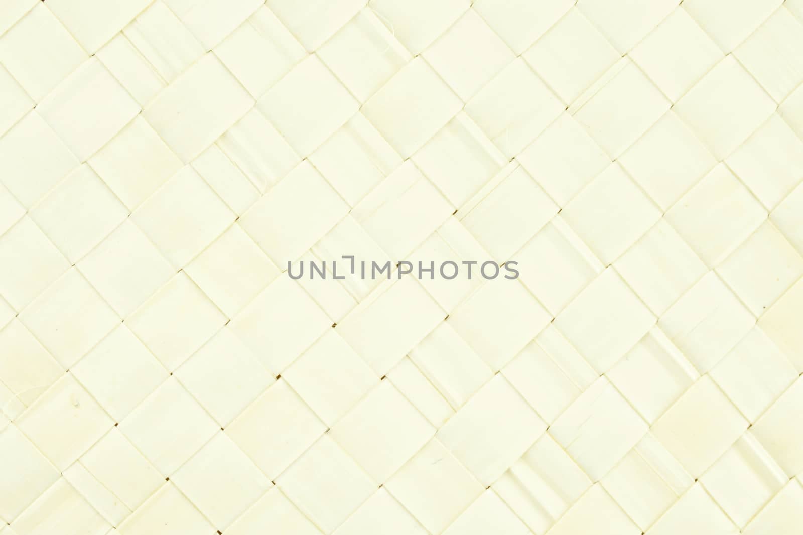 Cream basket wicker texture from palm leaves place as background.