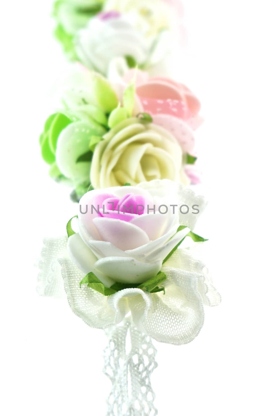 Close up vintage white and pink fabric flower isolated by eaglesky