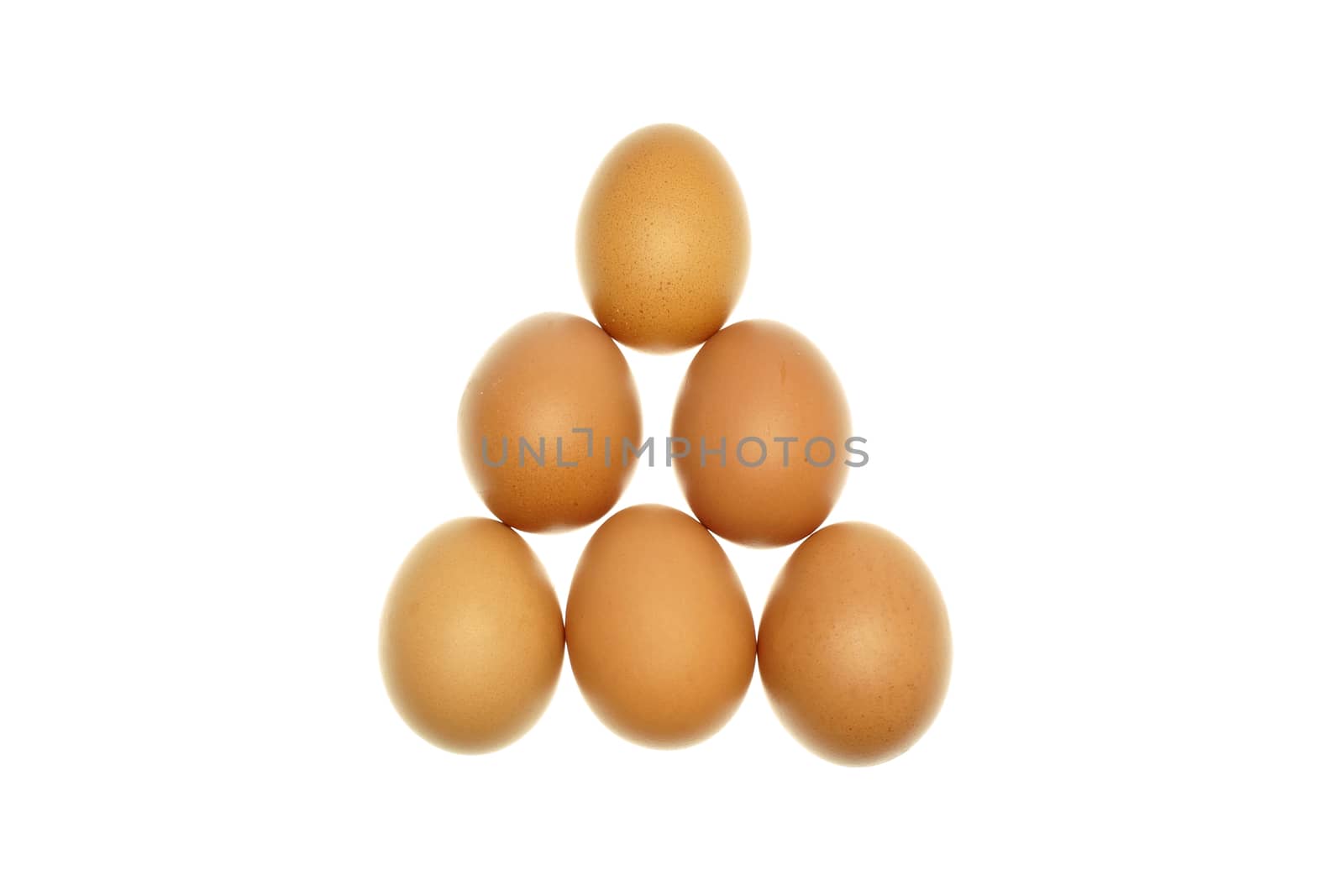 Brown eggs put as triangle isolated by eaglesky