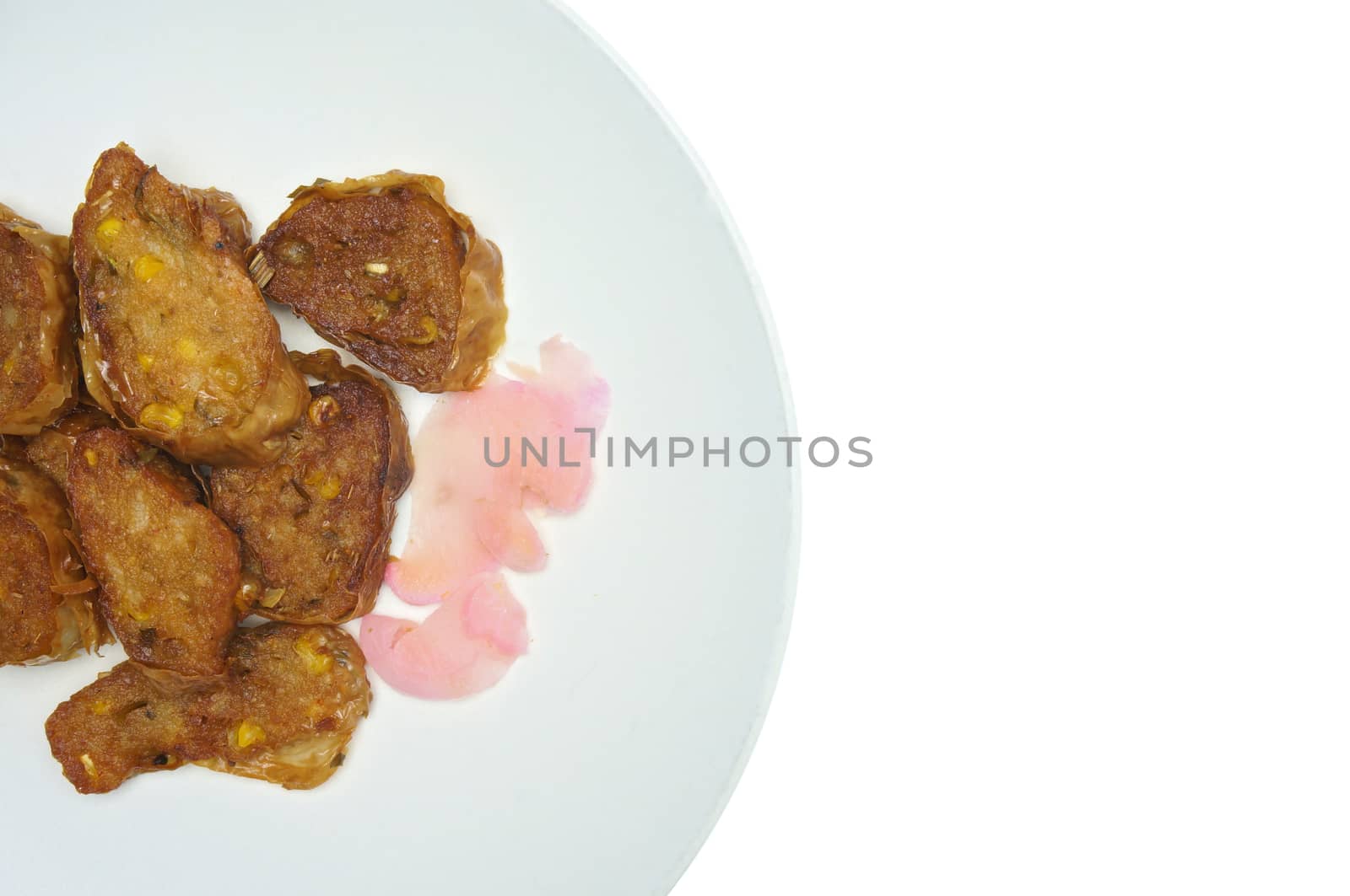 Deep fried roll vegetarian with ginger pickled on dish isolated with white background.