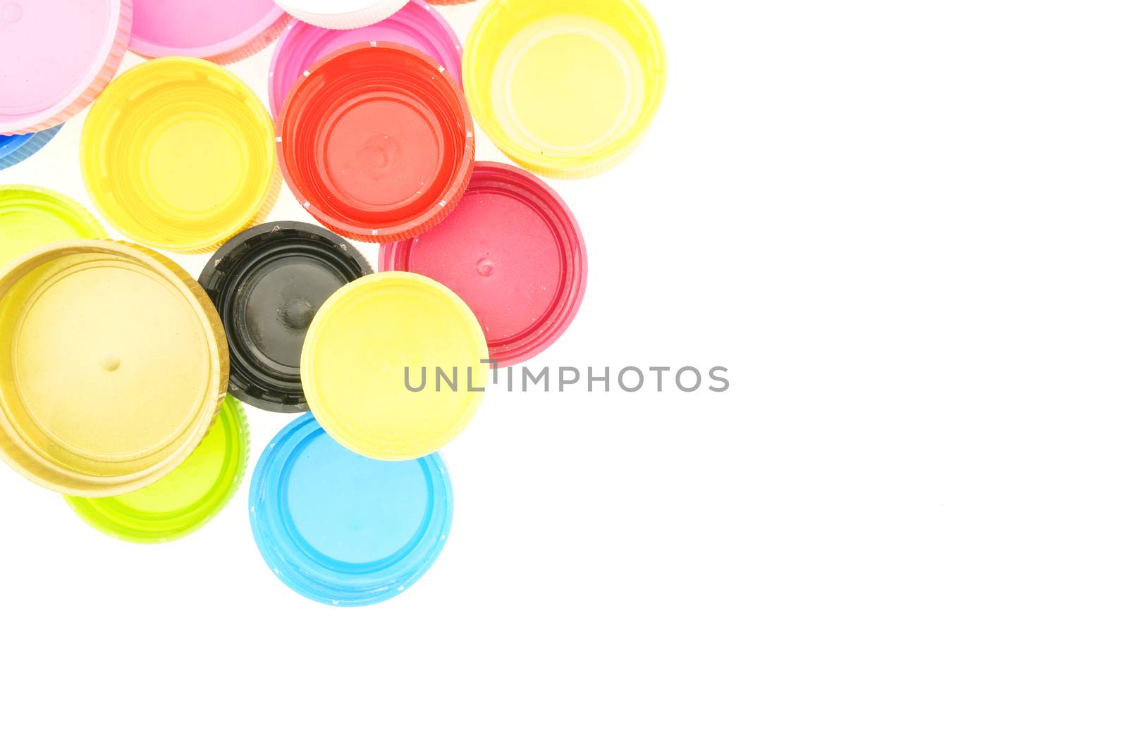 Colorful plastic bottle cap for recycling garbage isolated with white background.