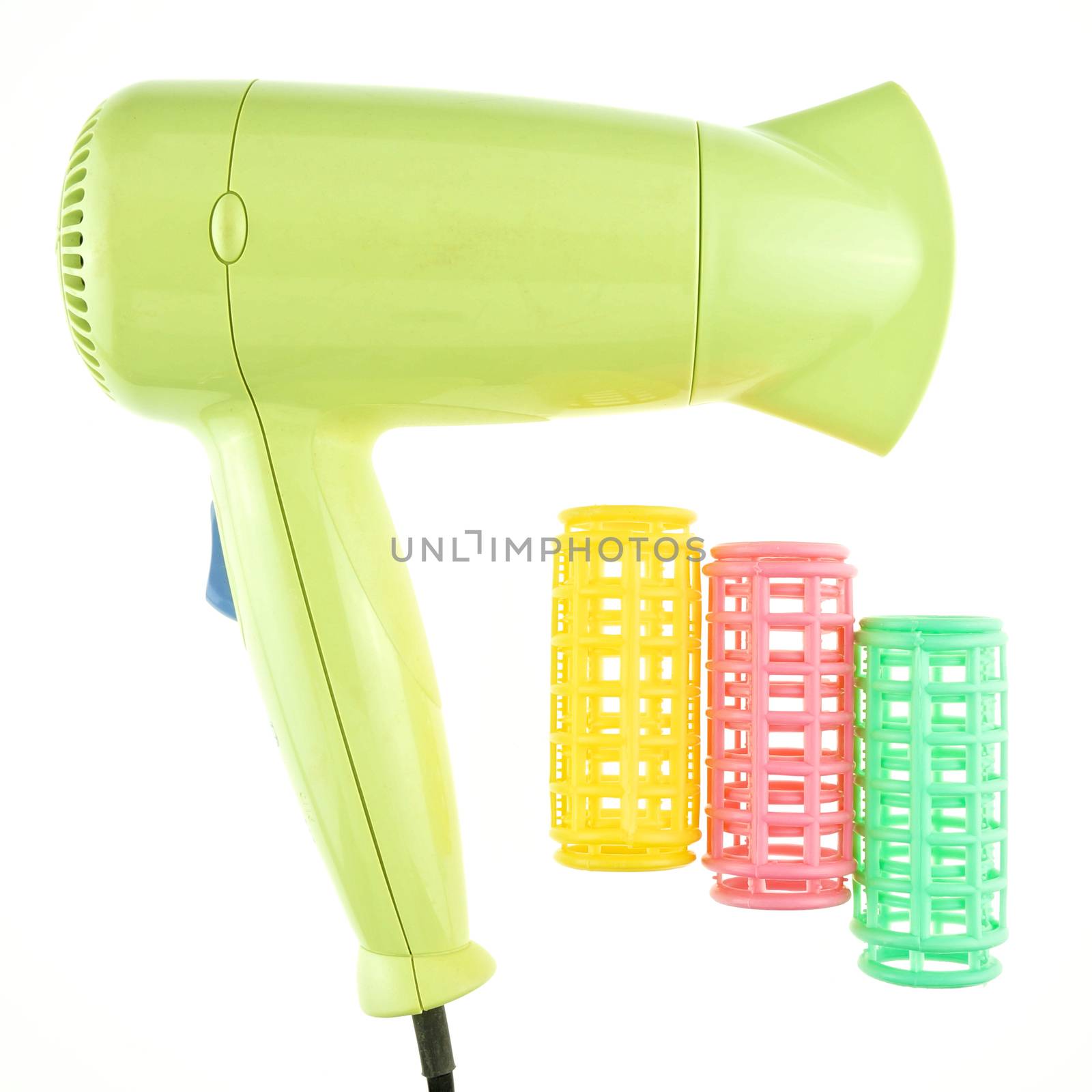 Old green hairdryer and colorful curler isolated by eaglesky